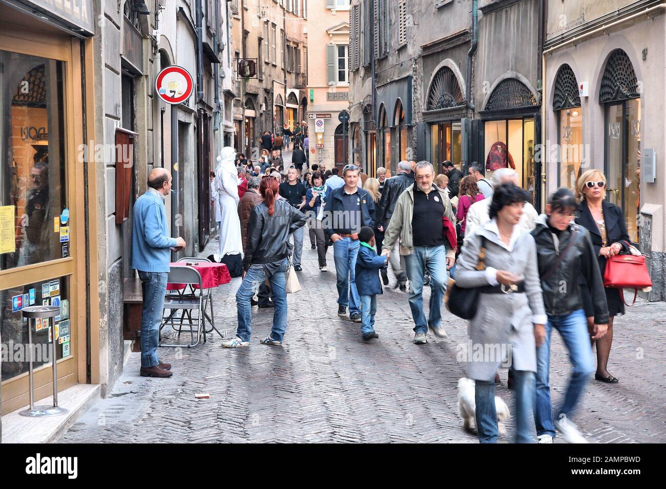 BERGAMO, ITALY - OCTOBER 20, 2012: People visit Old Town in Bergamo, Italy. In 2011 841,624 tourists visited Bergamo Province, among them 324,685 fore Stock Photo