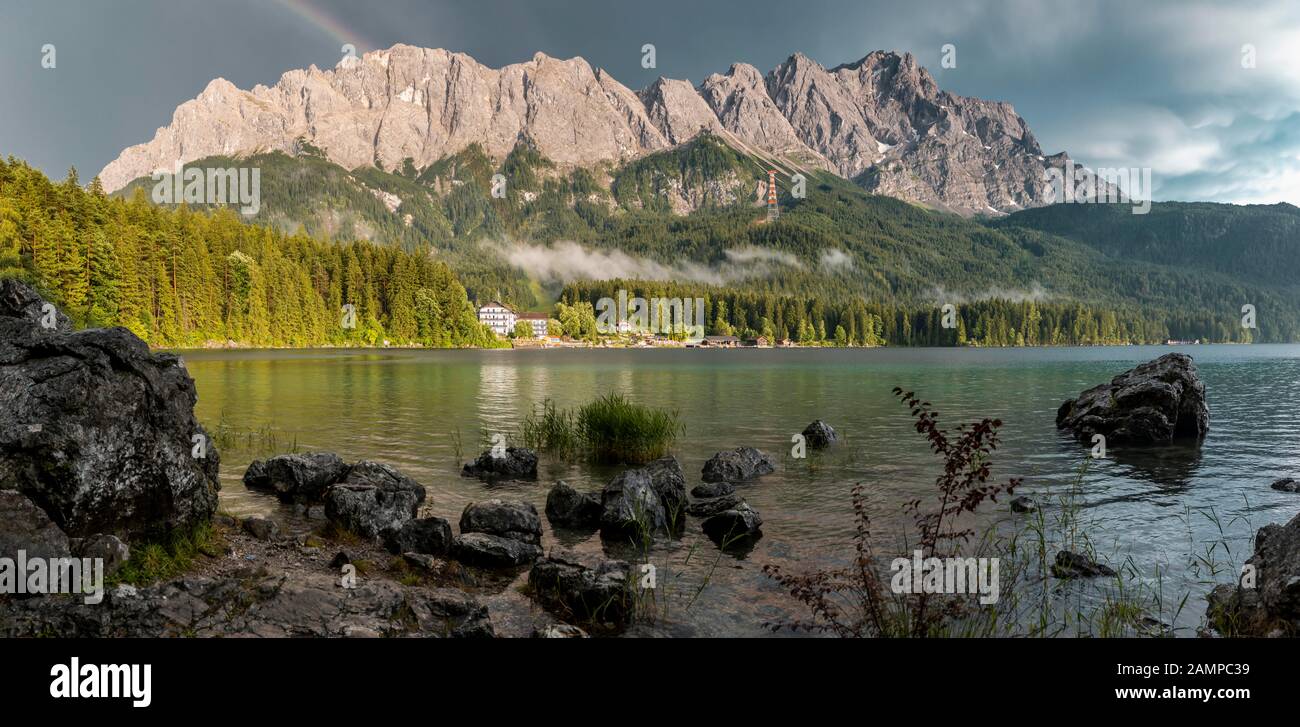Rocks on the shore, Eibsee lake in front of Zugspitze massif with ...