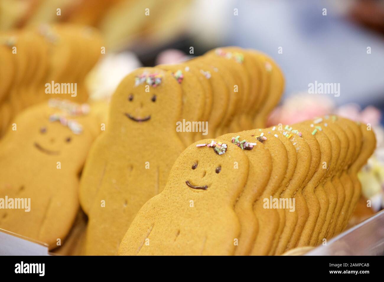 Close-up of a selection of gingerbread men for sale in a bakery. Stock Photo