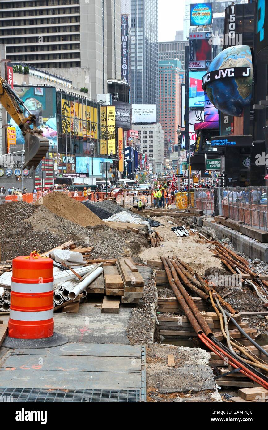 NEW YORK, USA - JULY 3, 2013: Workers perform construction works at Times Square in New York. The square at junction of Broadway and 7th Avenue has so Stock Photo