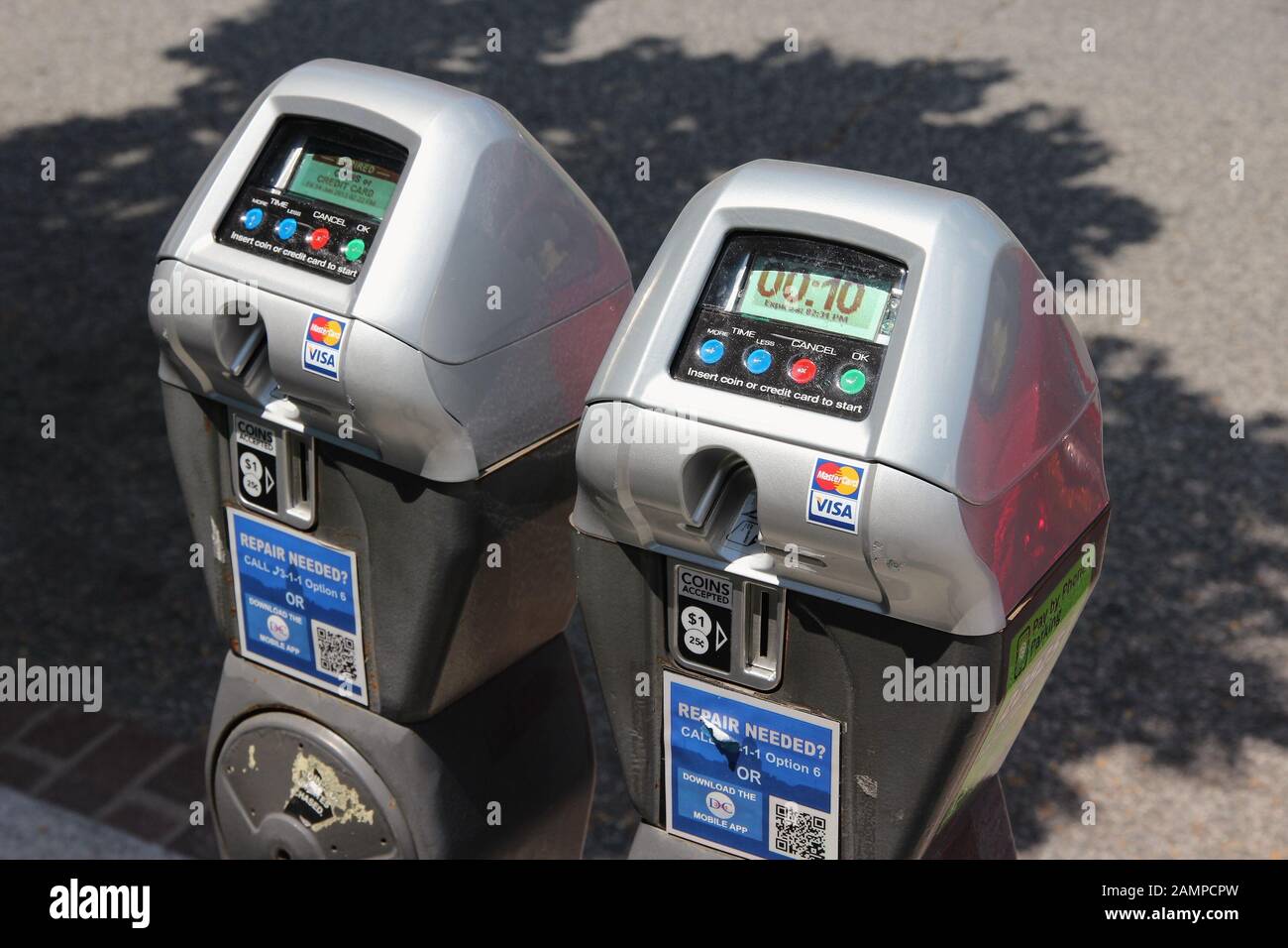 WASHINGTON DC, USA - JUNE 14, 2013: Parking meters in Washington DC. 646,000 people live in Washington DC (2013) making it the 23rd most populous US c Stock Photo