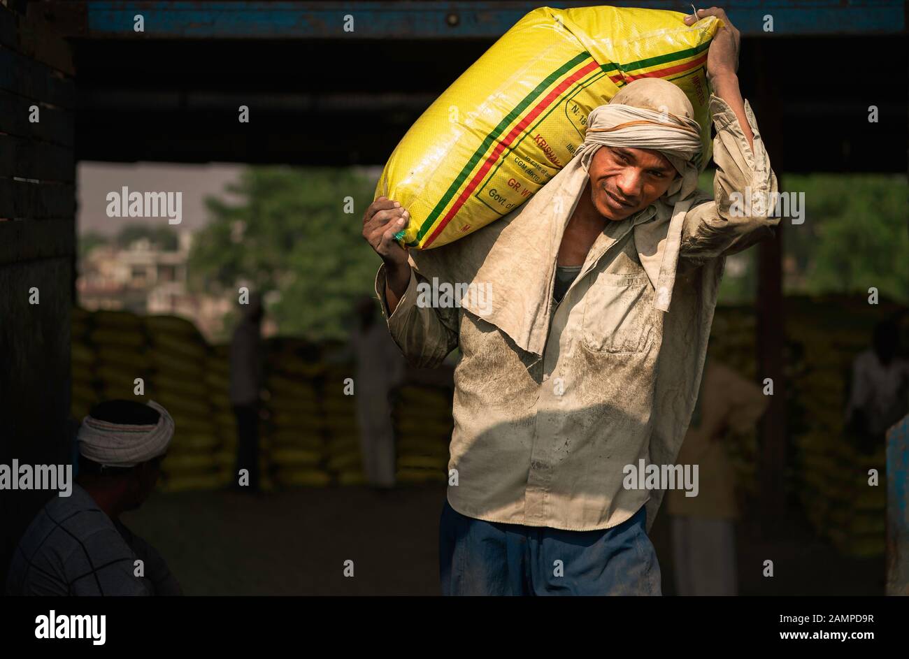 Man carrying cement bag hires stock photography and images Alamy