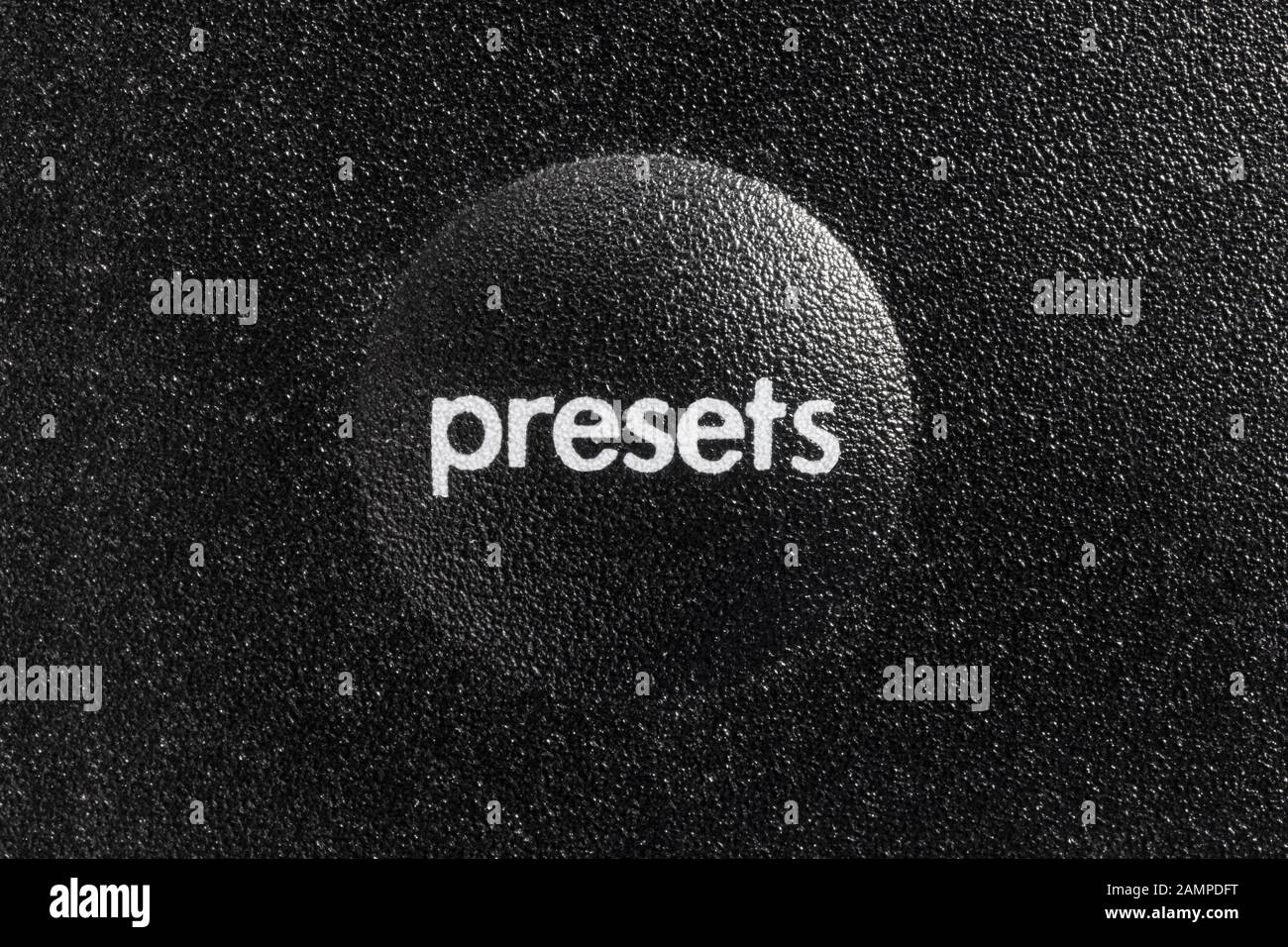Macro close up photograph of presets button on remote audio controller. Stock Photo