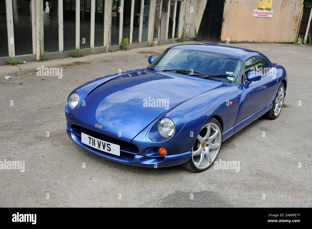 British TVR Cerbera muscle car parked in front of a disused garage showroom Stock Photo