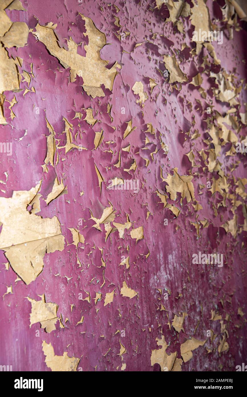 Grunge peeling purple paint background texture. Stock Photo
