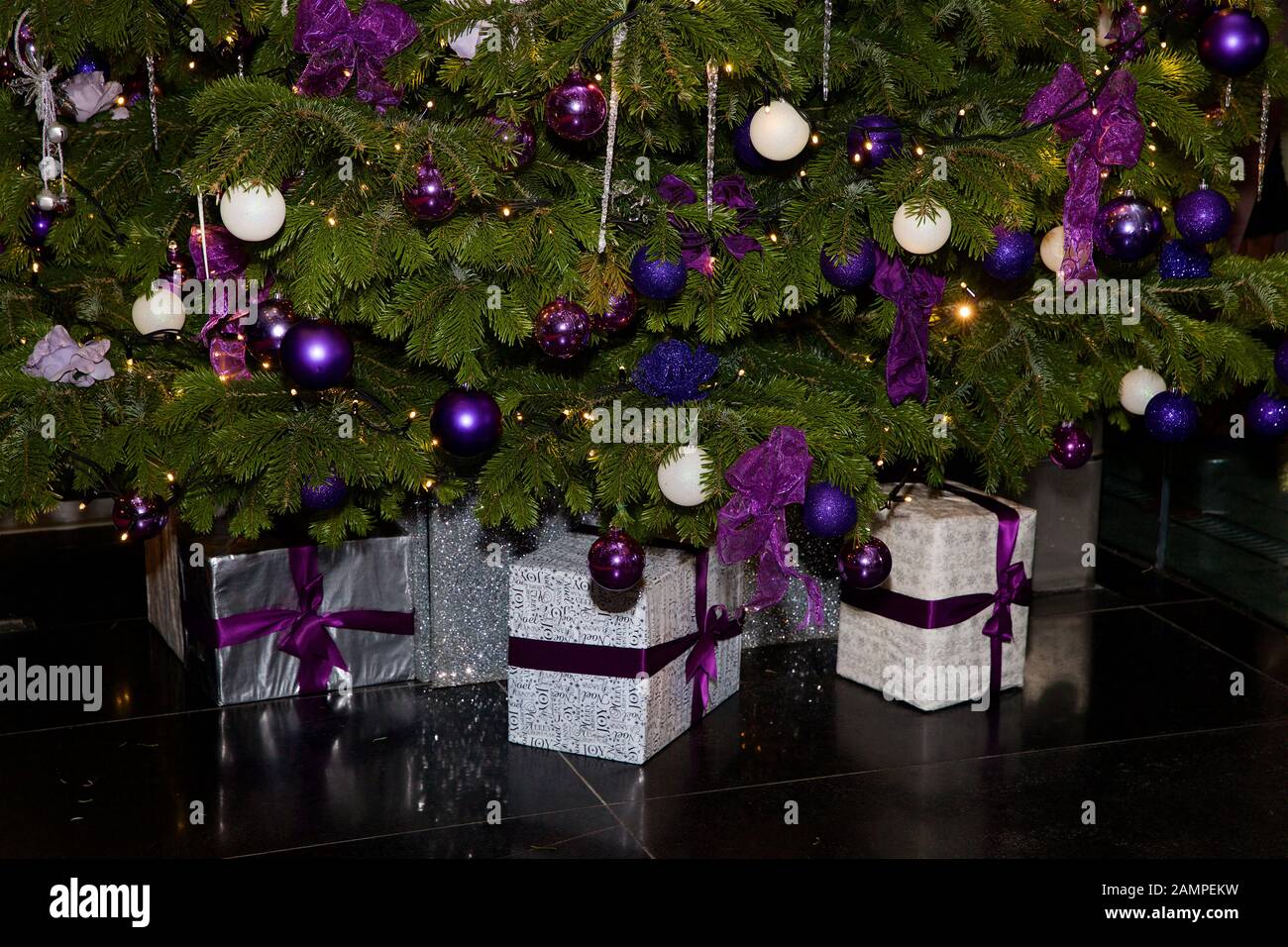 Christmas gifts under a Christmas tree. Stock Photo