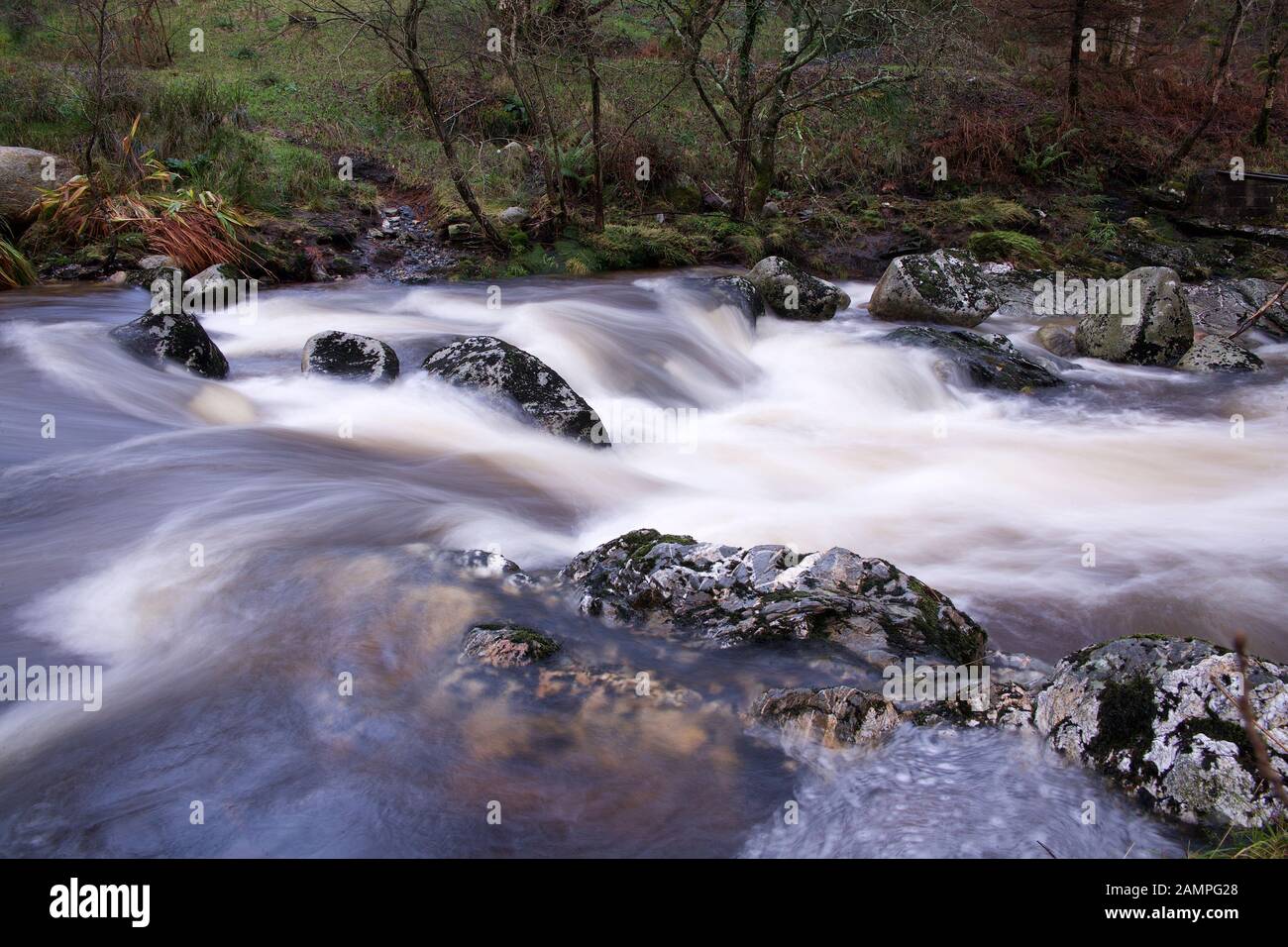 Slow exposure shot of white water rapids on a river in County Wicklow, Ireland. Stock Photo