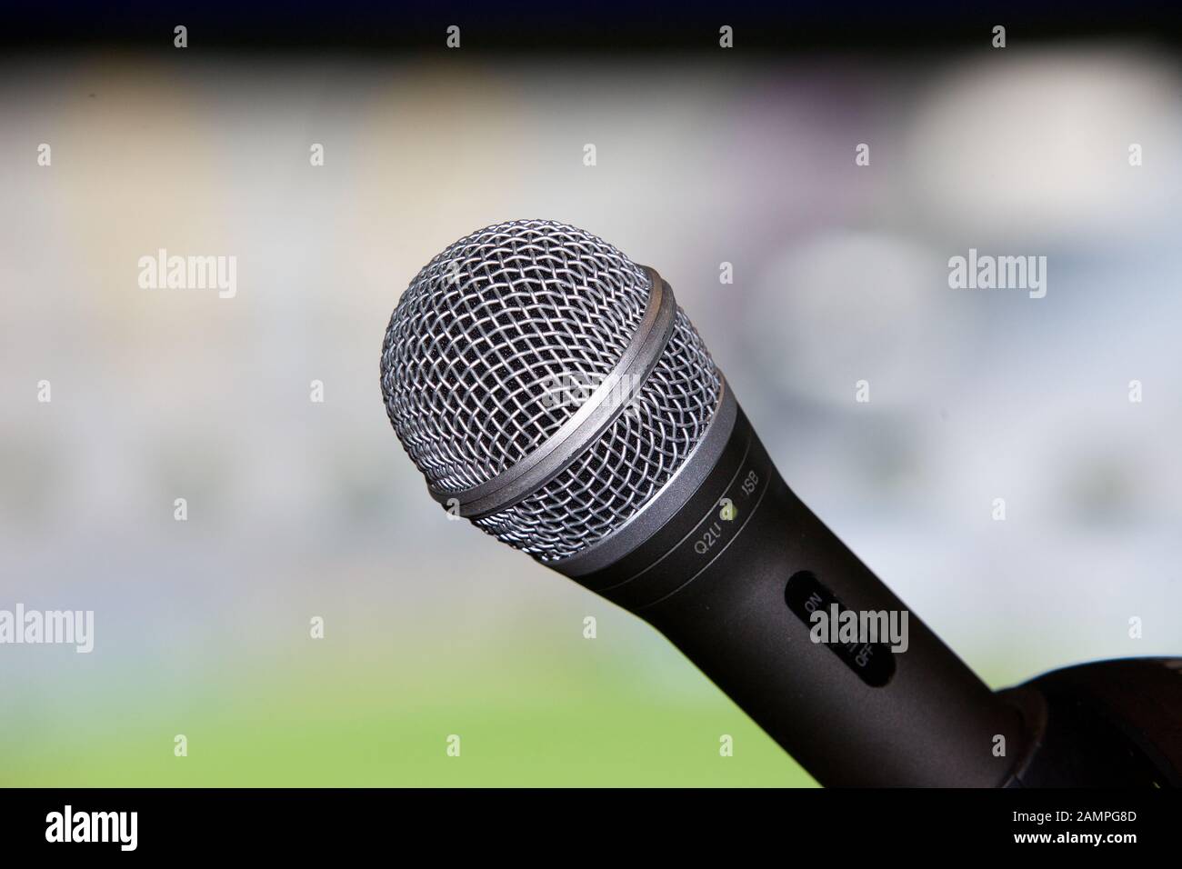 Close-up shot of a microphone and in the commentary box of a sports venue. Stock Photo