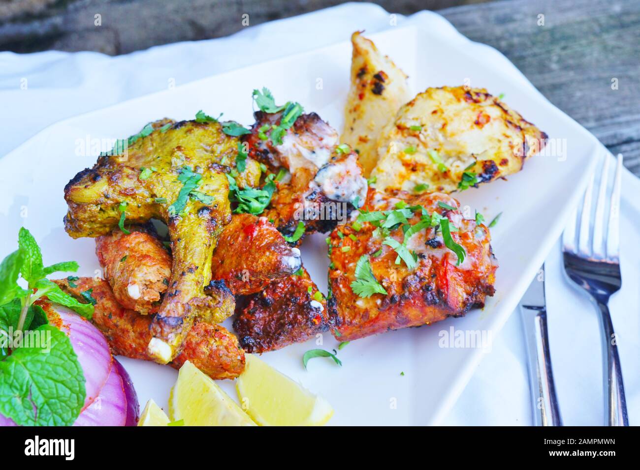A tandoori mixed grill platter with lamb and chicken at an Indian  restaurant Stock Photo - Alamy