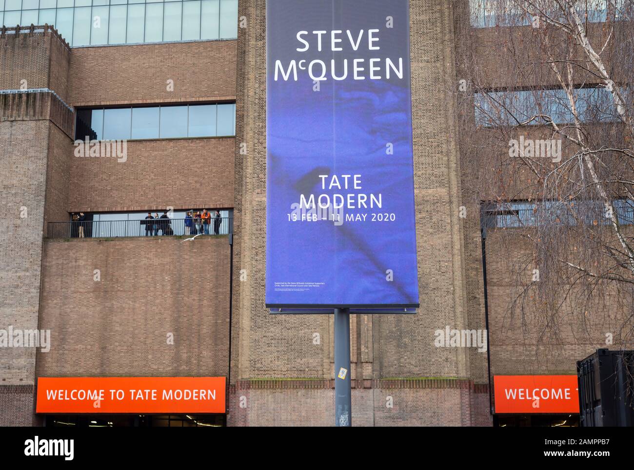 Banner outside Tate Modern in London advertising upcoming exhibition by Steve McQueen which will take place between 13 February and 11 May 2020. Stock Photo