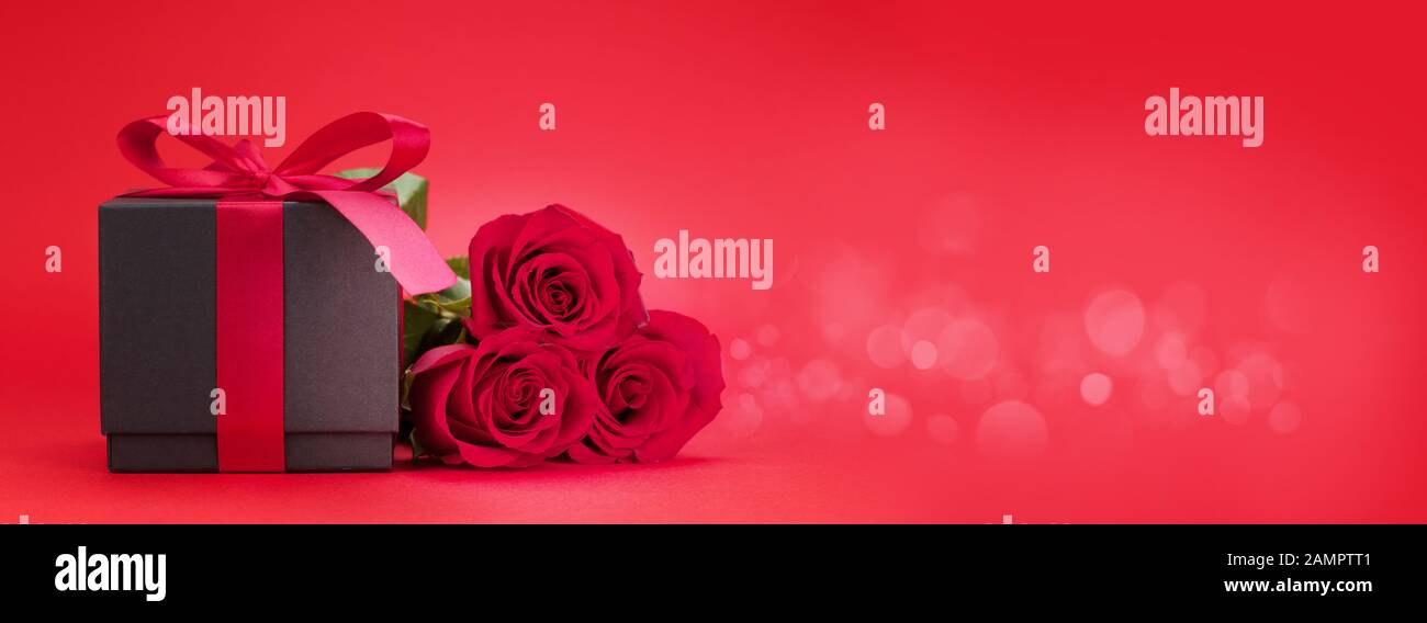 Valentines day greeting card with rose flower bouquet and gift box over ...