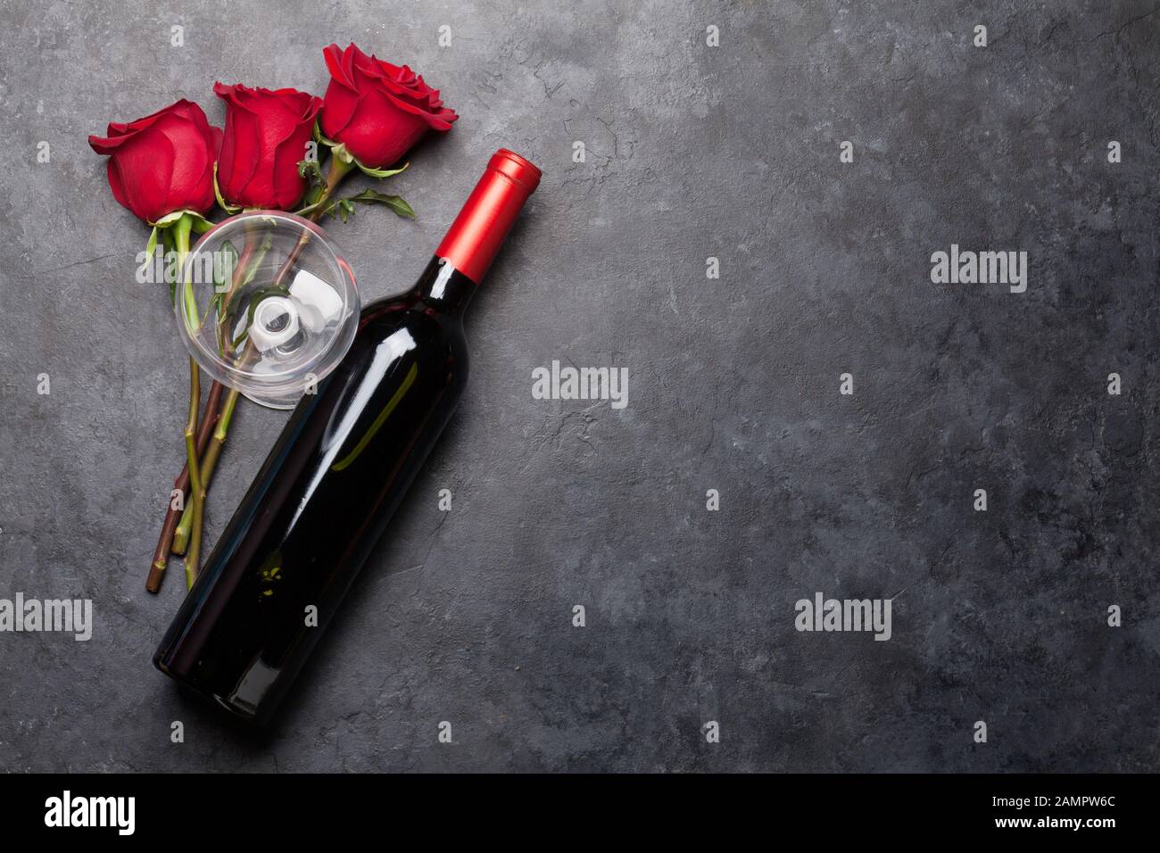 Valentines day greeting card with rose flowers and red wine bottle on ...