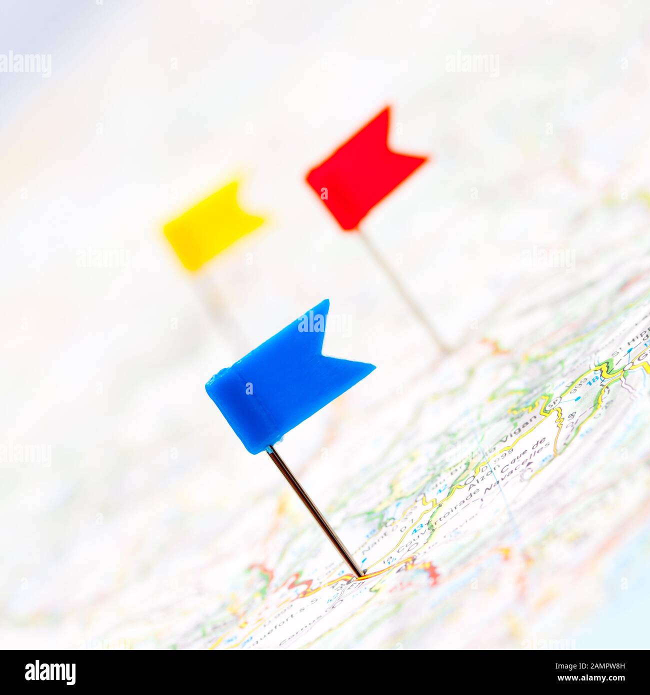 Three color flag pins on a map, shallow focus Stock Photo Alamy