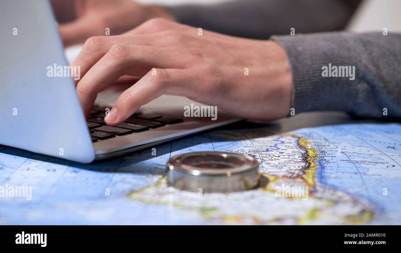 Planning vacation laptop map hi-res stock photography and images - Alamy