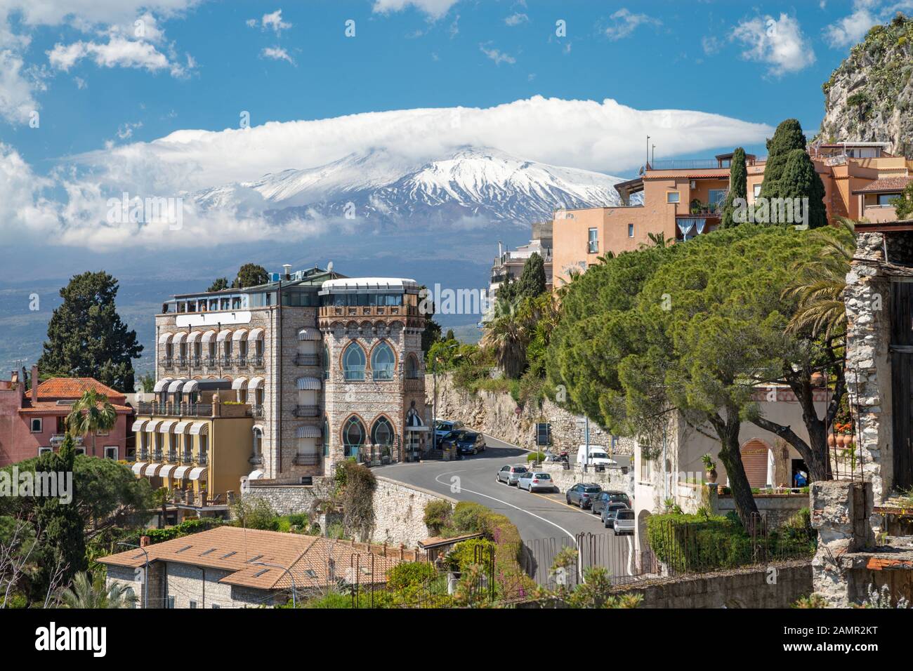 Taormina - The Mt. Etna volcano over the city. Stock Photo