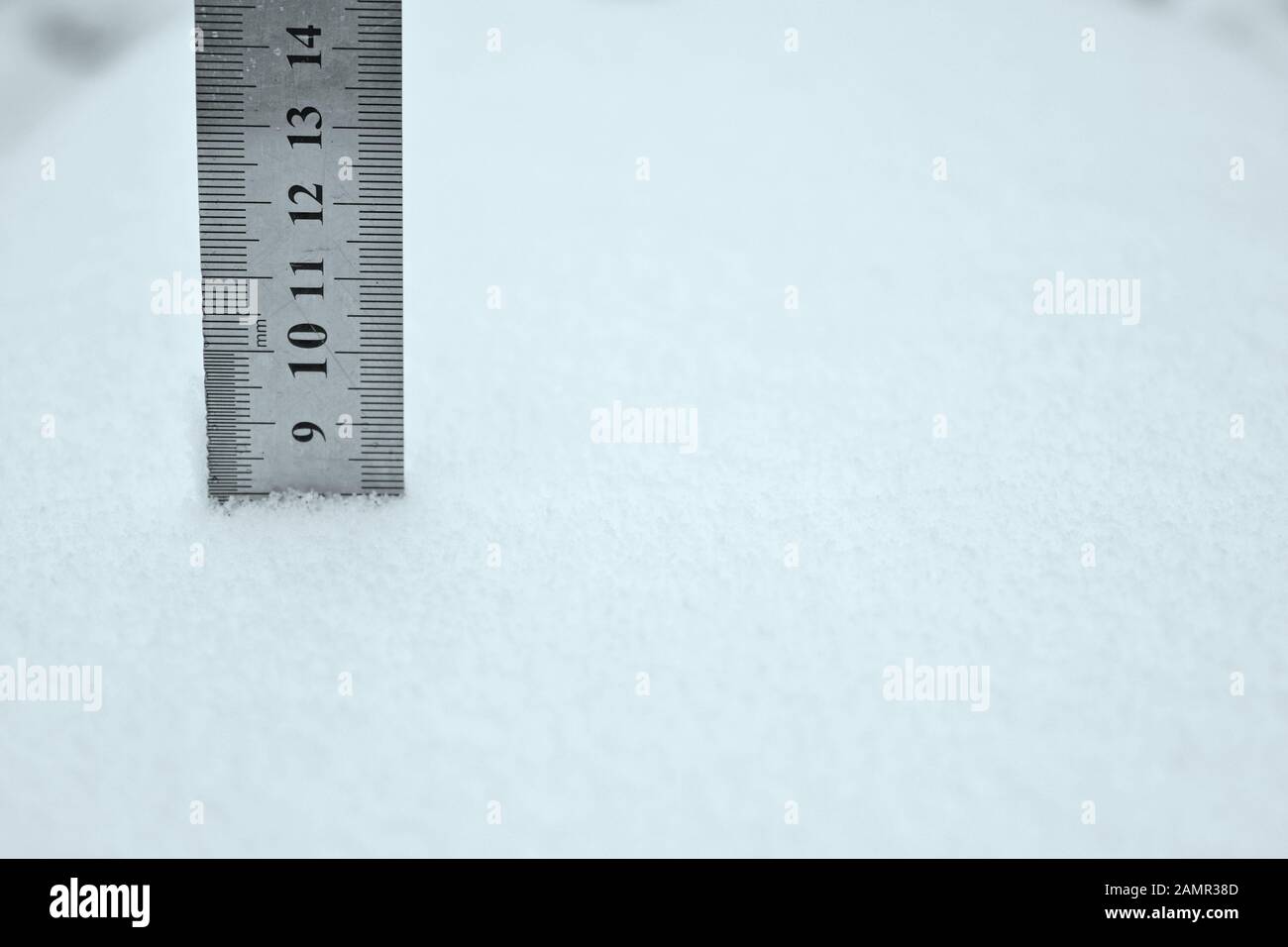 photo with a centimeter ruler as an indicator of snow depth Stock Photo