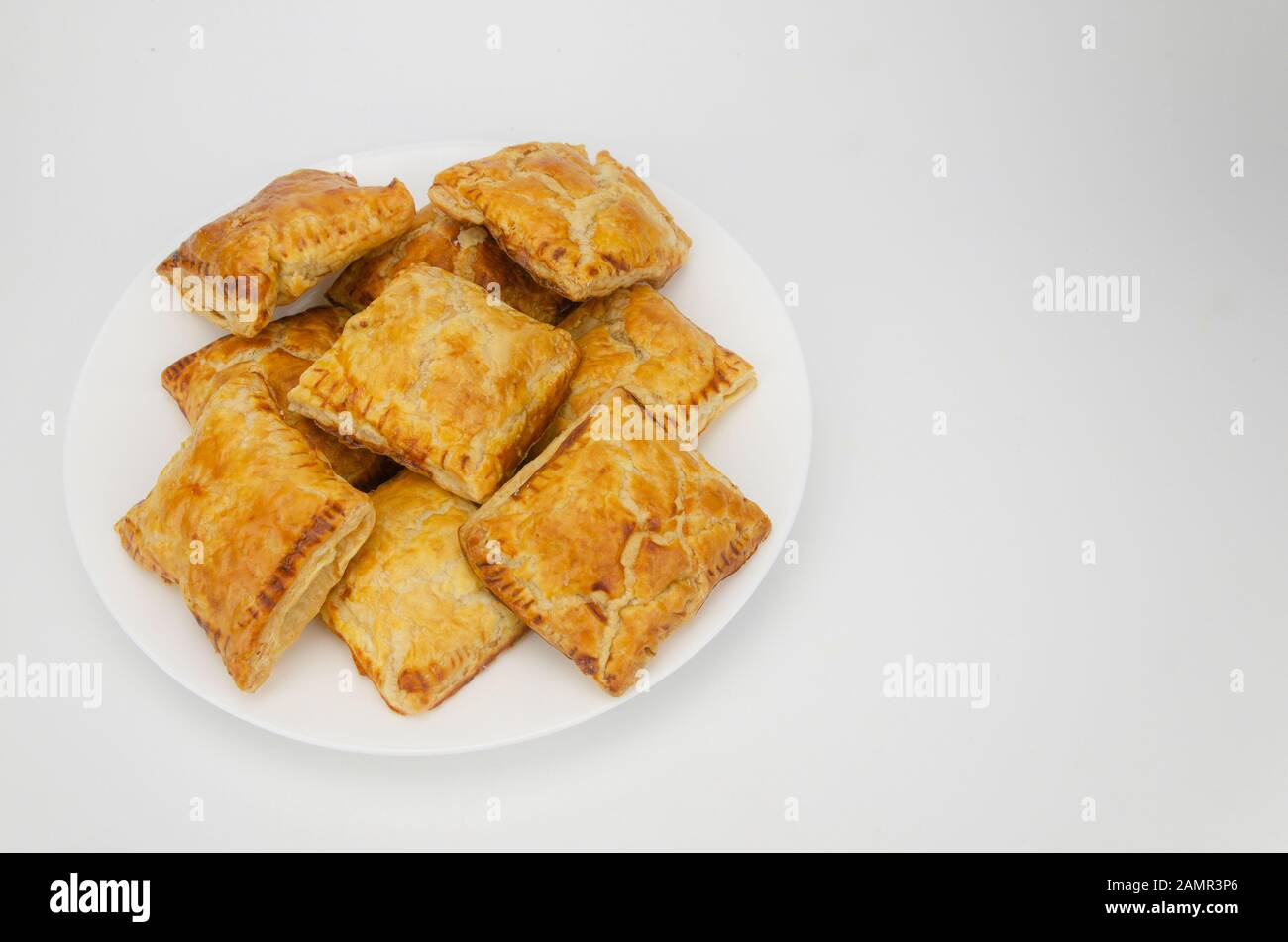 Puff pastries stuffed with guava isolated on white background. Cenital