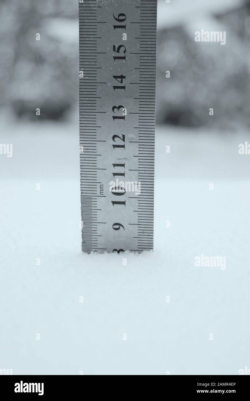 photo with a centimeter ruler as an indicator of snow depth Stock Photo