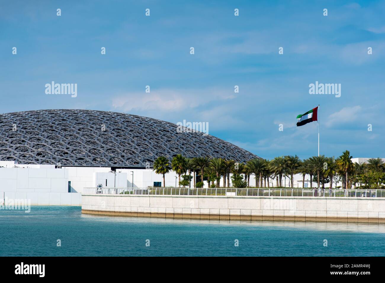 Abu Dhabi, United Arab Emirates - December 20, 2019: Louvre museum in Abu Dhabi exterior with characteristic architecture on a sunny day Stock Photo