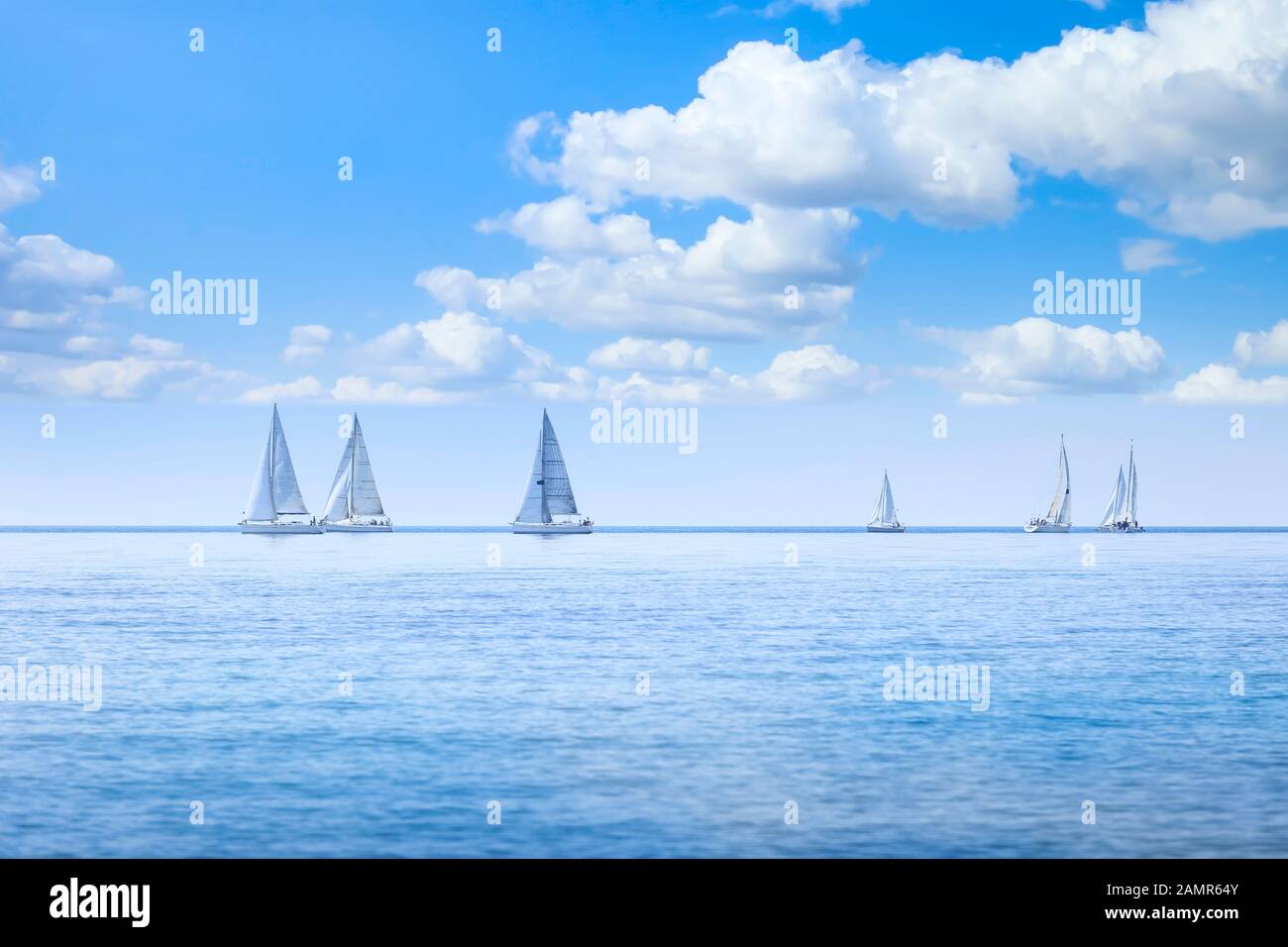 Sailing boat yacht or sailboat group regatta race on sea or ocean water. Panoramic view. Stock Photo