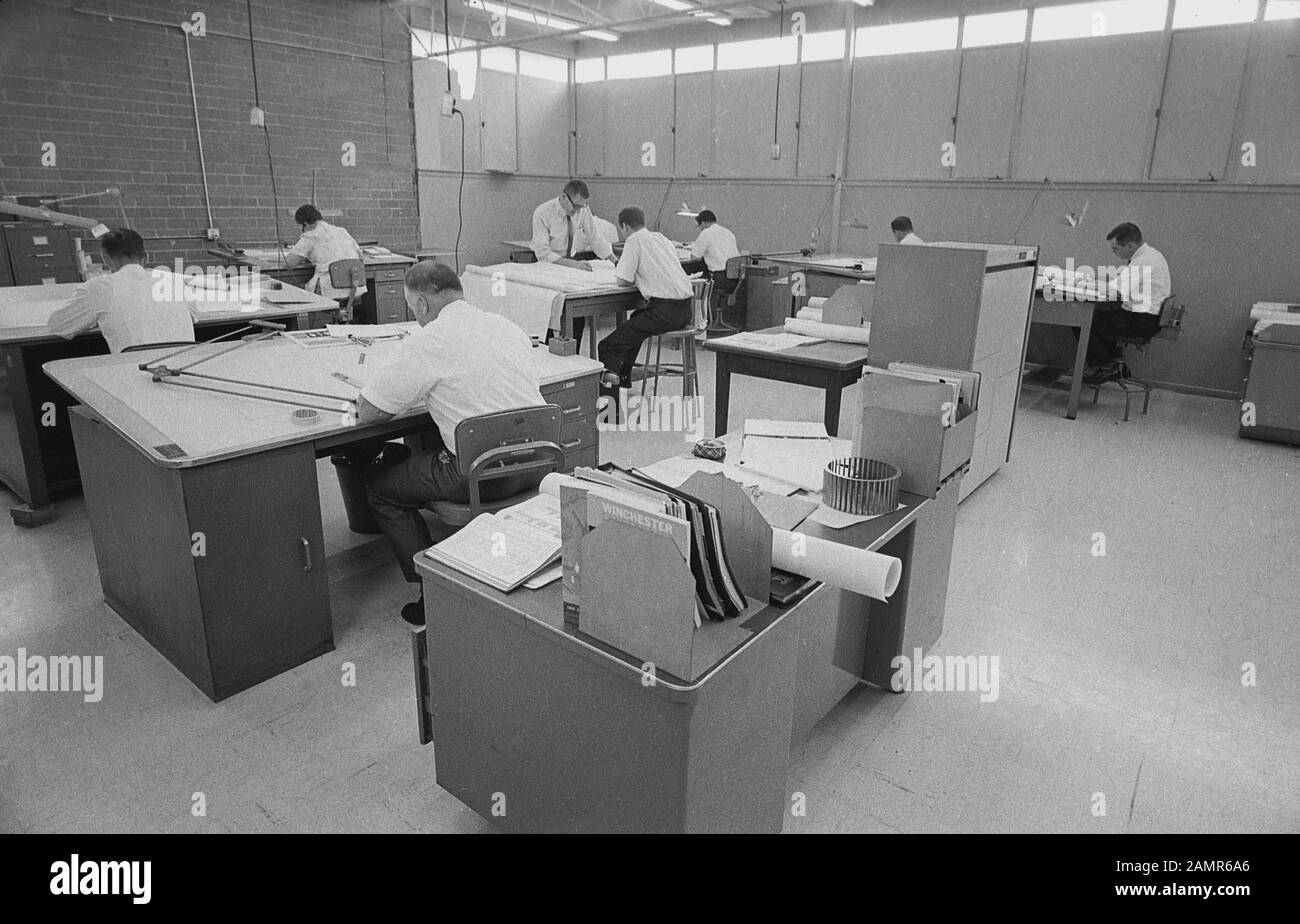 1980s, historical, male employees working at their desks in a technical drawing office, England, UK. Also known as drafting or draughting, it involves skilled, professional workers - known as drafters or sometimes design engineers or technical designers - making detailed drawings and plans that communicate ideas in architecture, industry and engineering. In this era, before the introduction of CADD - computer-aided design and drafting - revolutionised the sector,  the work was still a manual process. Stock Photo