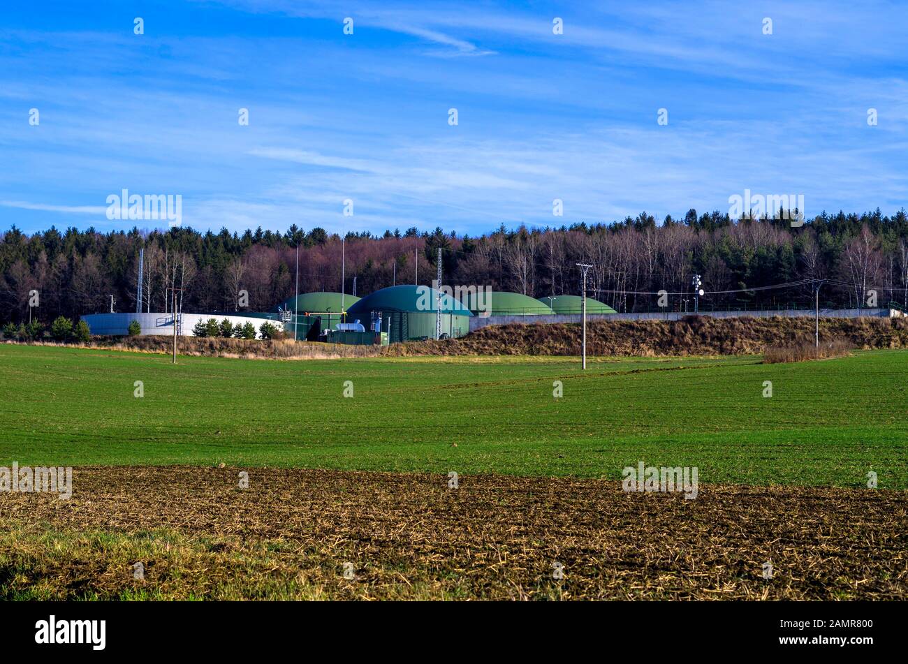 Agricultural biogas plants with storage tanks. The station processes waste from hen breeding. Production of clean energy in nature, sustainable energy Stock Photo