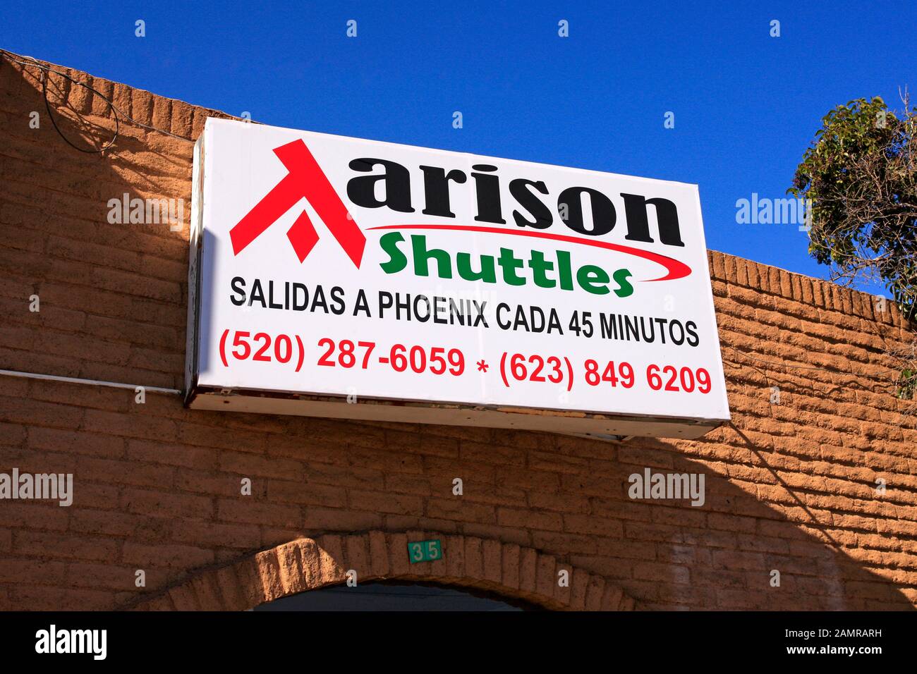 Shuttle bus company sign - regular transportation to Phoenix for mexicans from the border city of Nogales AZ Stock Photo
