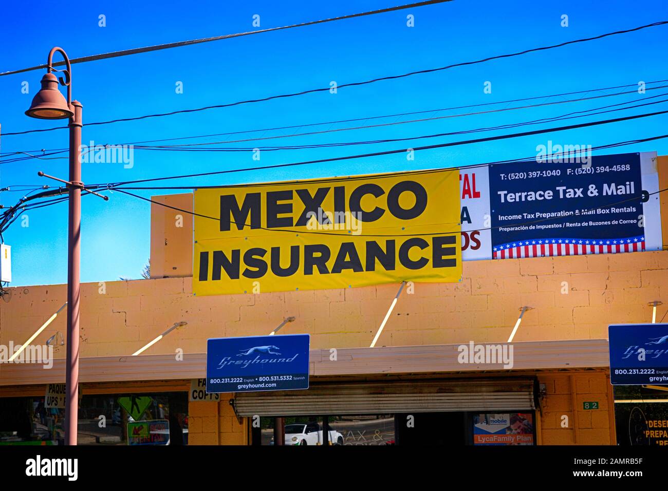 Mexico Insurance banner above the Greyhound Bus station offices in the US-Mexican border city of Nogales, AZ Stock Photo