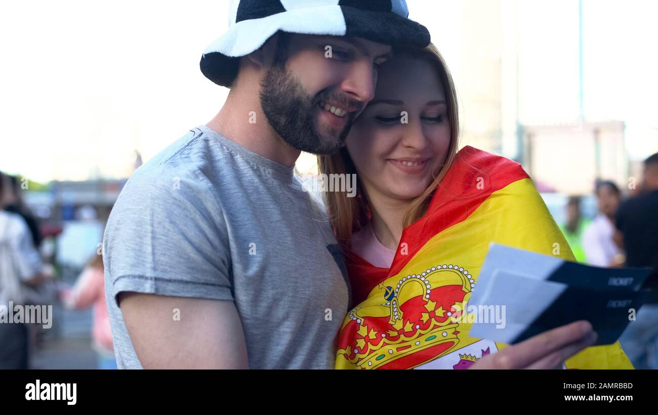 Spanish football fans couple happy to buy final match tickets, competition  Stock Photo - Alamy