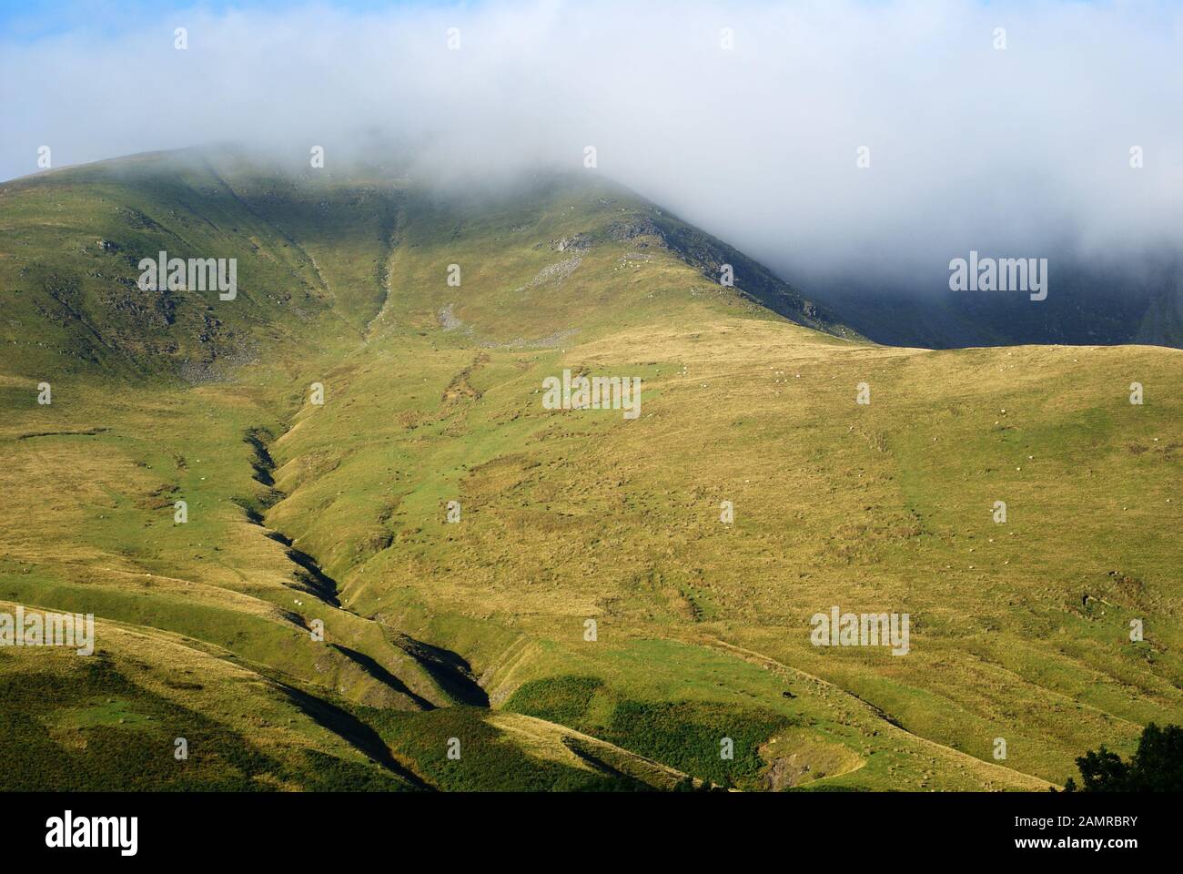 Low cloud over one of the Howgill Fells. Although in the Yorkshire Dales National Park the Howgill Fells are mainly in the county of Cumbria Stock Photo