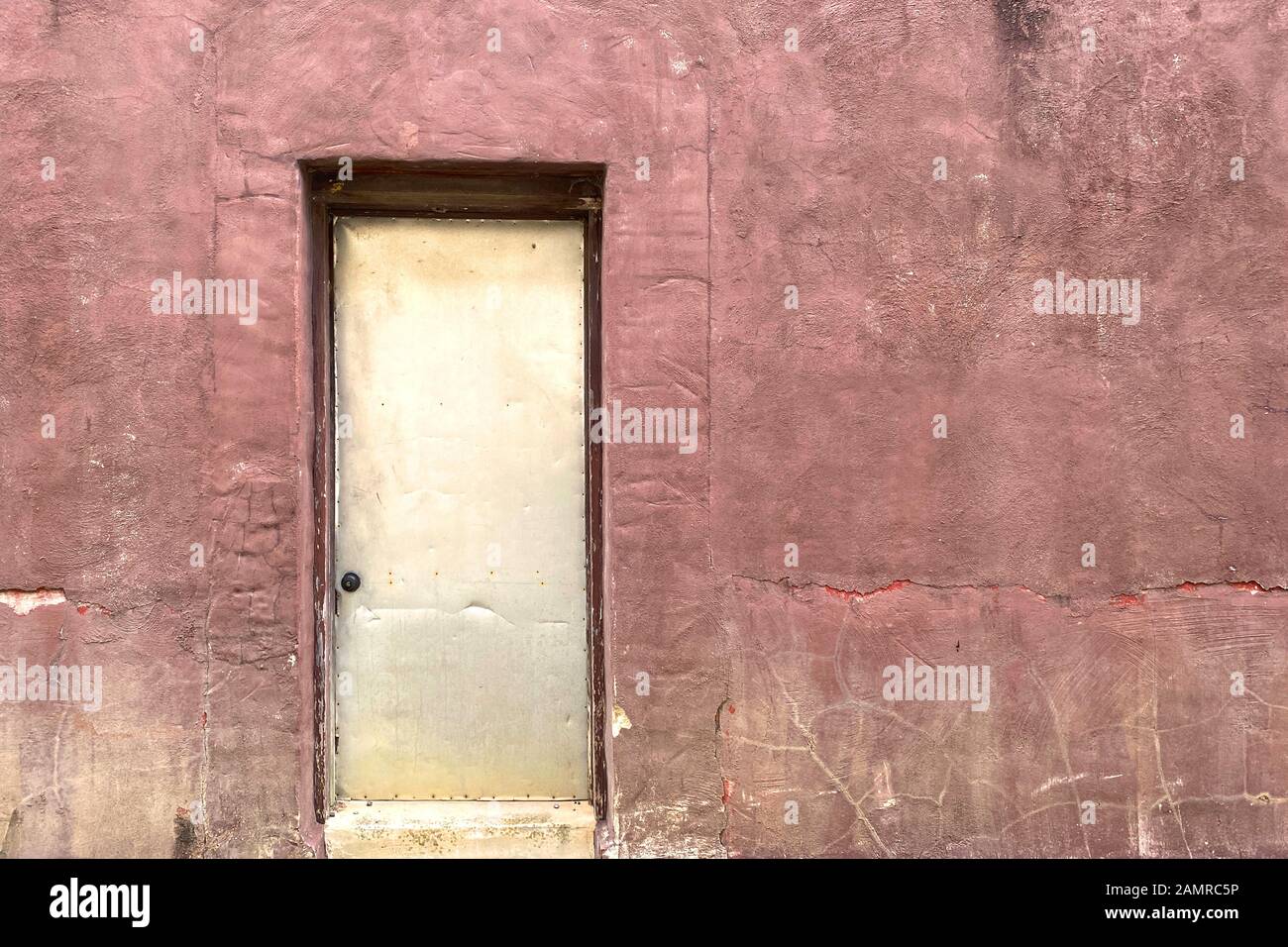 an abandoned alley back door od building Stock Photo