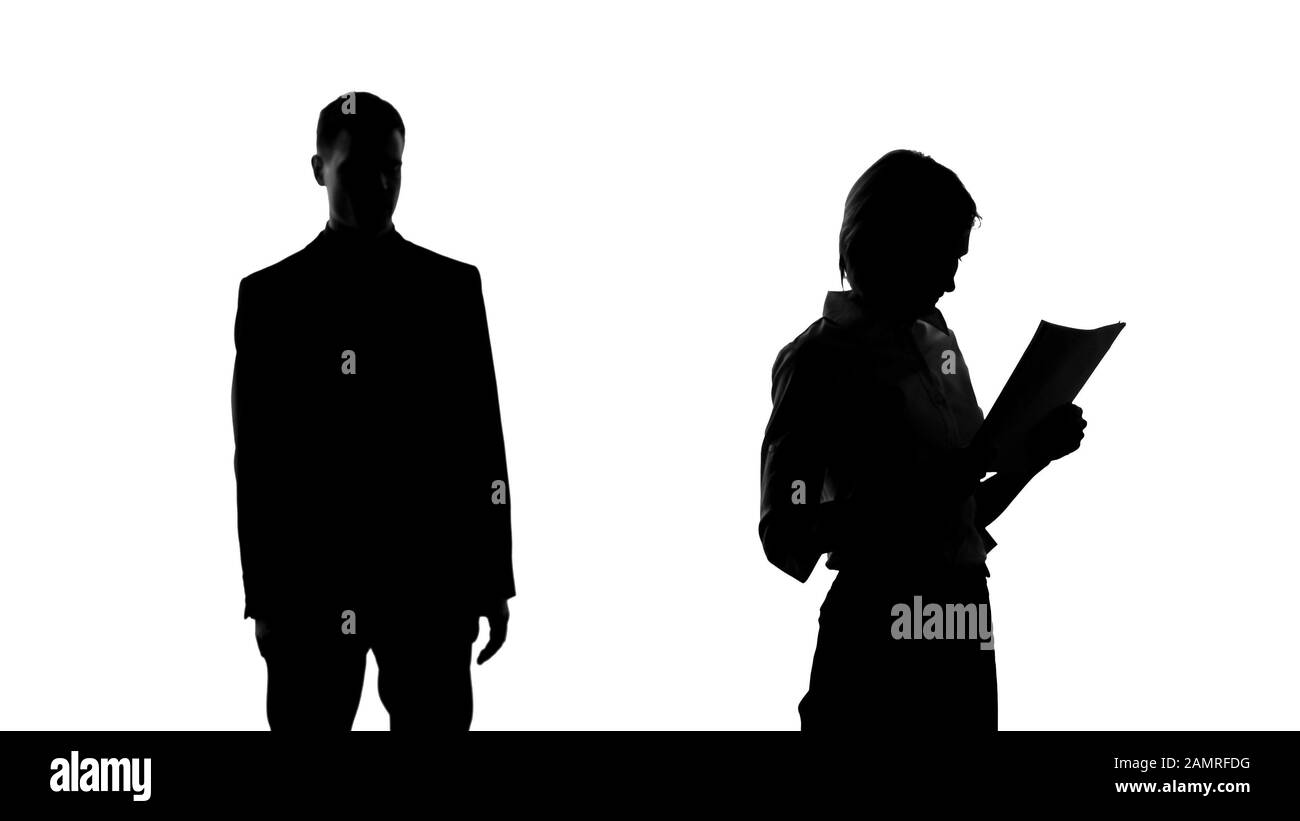 Male silhouette looking at female college with lust, dreaming about relationship Stock Photo