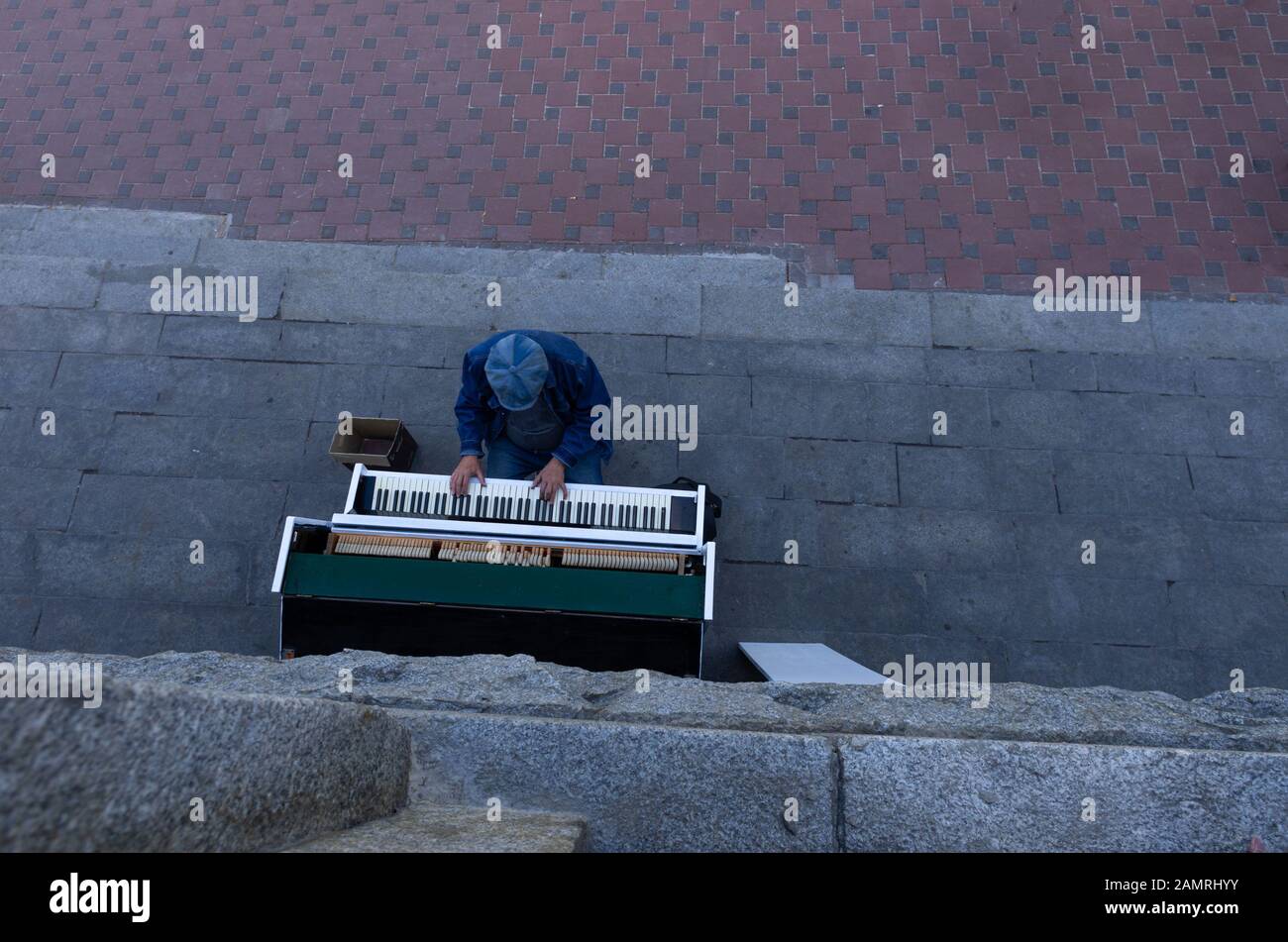 A man plays the piano. Street music on the piano. Top. Stock Photo