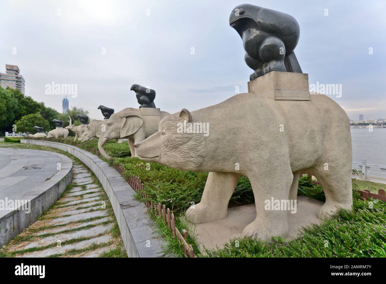 Animal figures holding an Eagle tripod. Dayu Myth Park. Wuhan, China Stock Photo