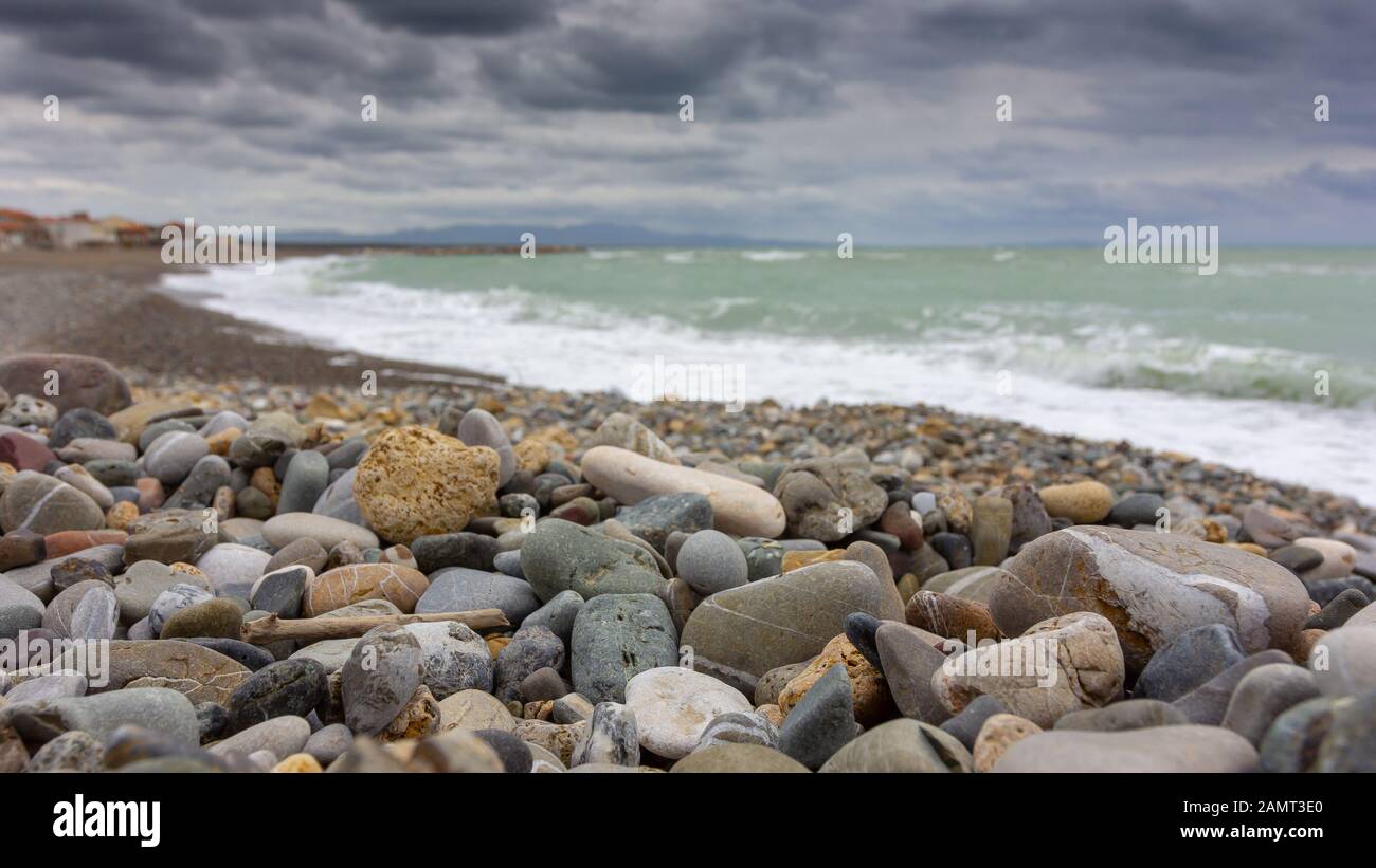 Rocks on beach, Tuscany, Italy Stock Photo - Alamy