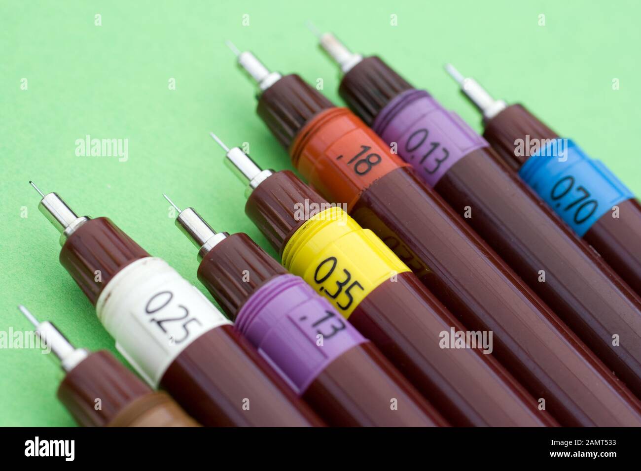 Technical drawing pens on green background Stock Photo Alamy