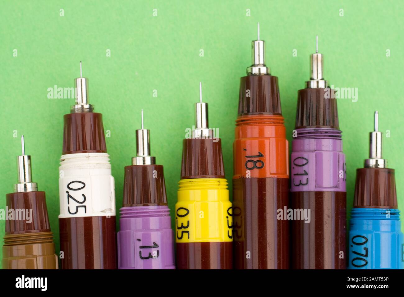 Technical drawing pens on green background Stock Photo Alamy