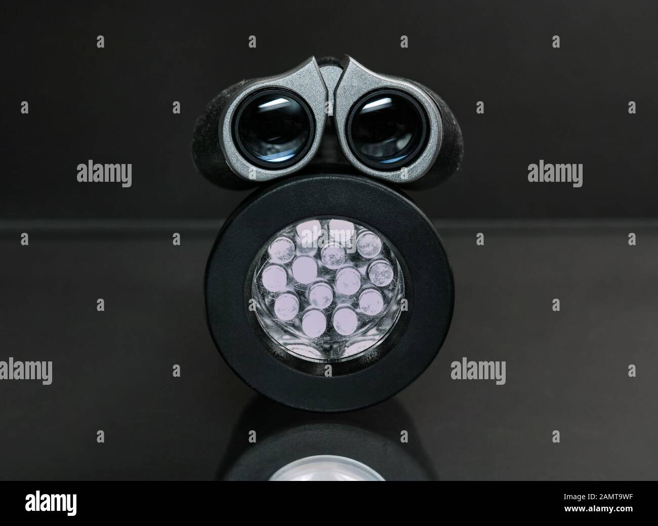 Binoculars on top of a torch: a sinister 'thing'... Stock Photo