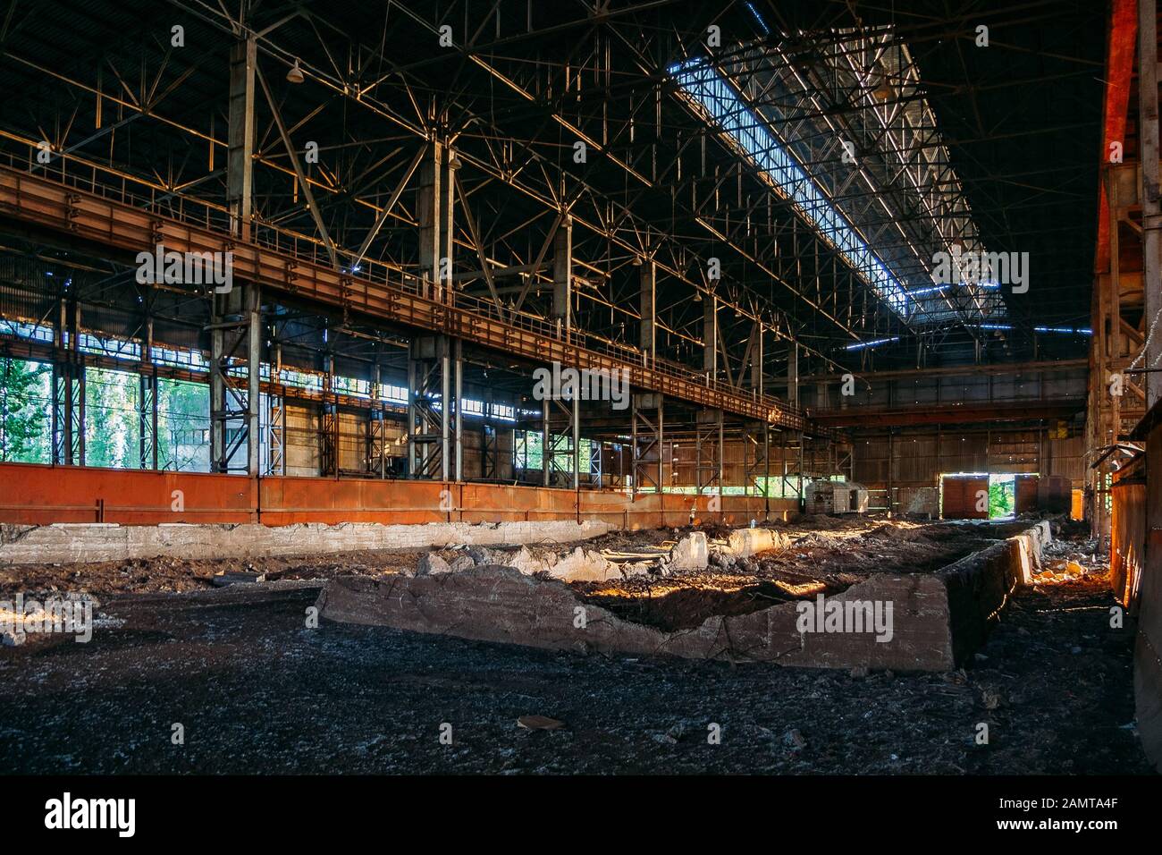 Abandoned ruined large industrial building with garbage waiting for ...