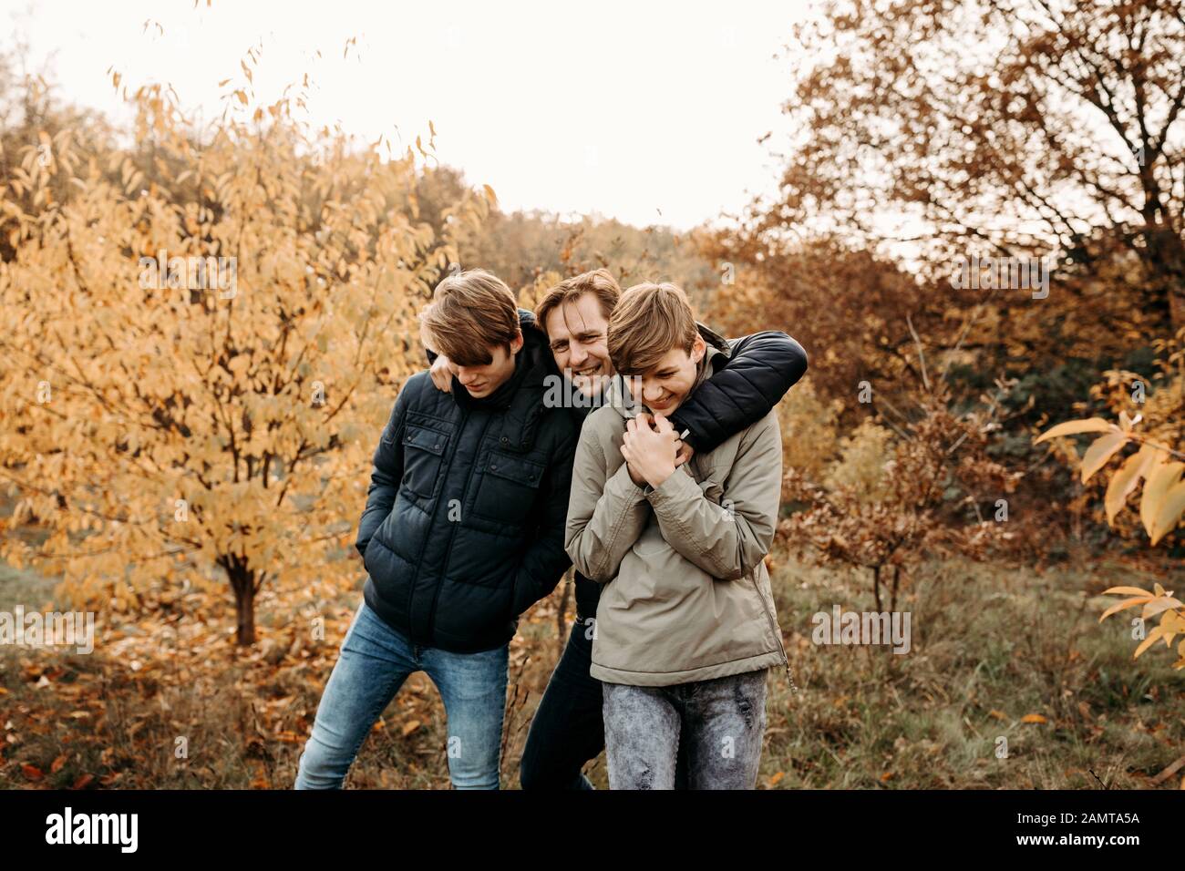 Portrait of a father with his two sons in rural landscape, Netherlands Stock Photo