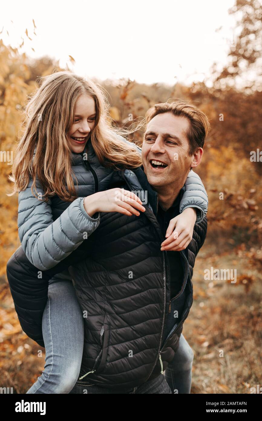 Farther giving his daughter a piggyback ride, Netherlands Stock Photo