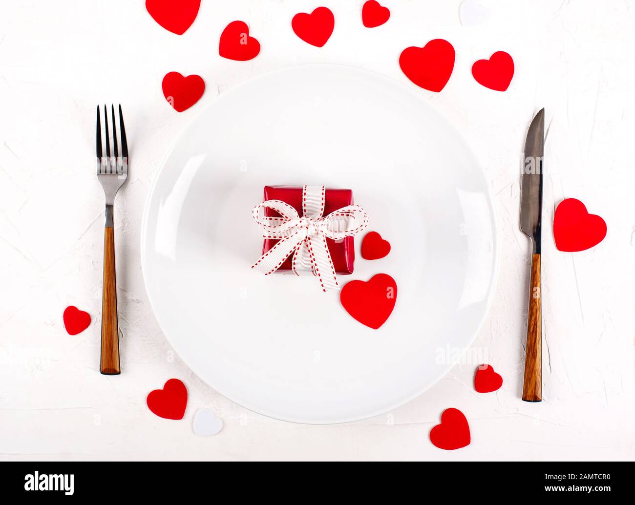 Table setting with red gift box for Valentines day Stock Photo