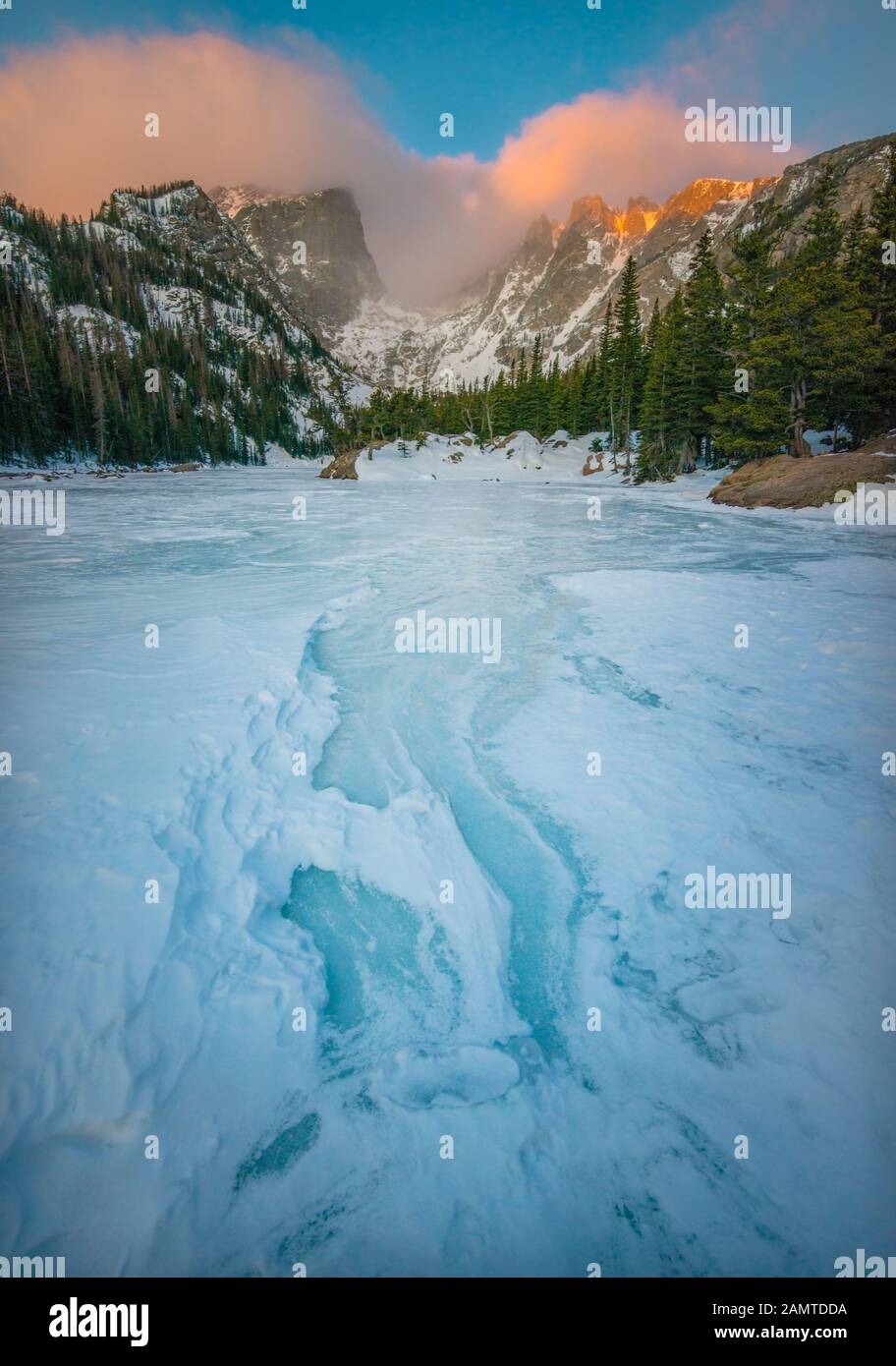 Frozen Dream Lake and Hallett Peak at Sunrise, rocky Mountain National Park, Colorado, USA Stock Photo