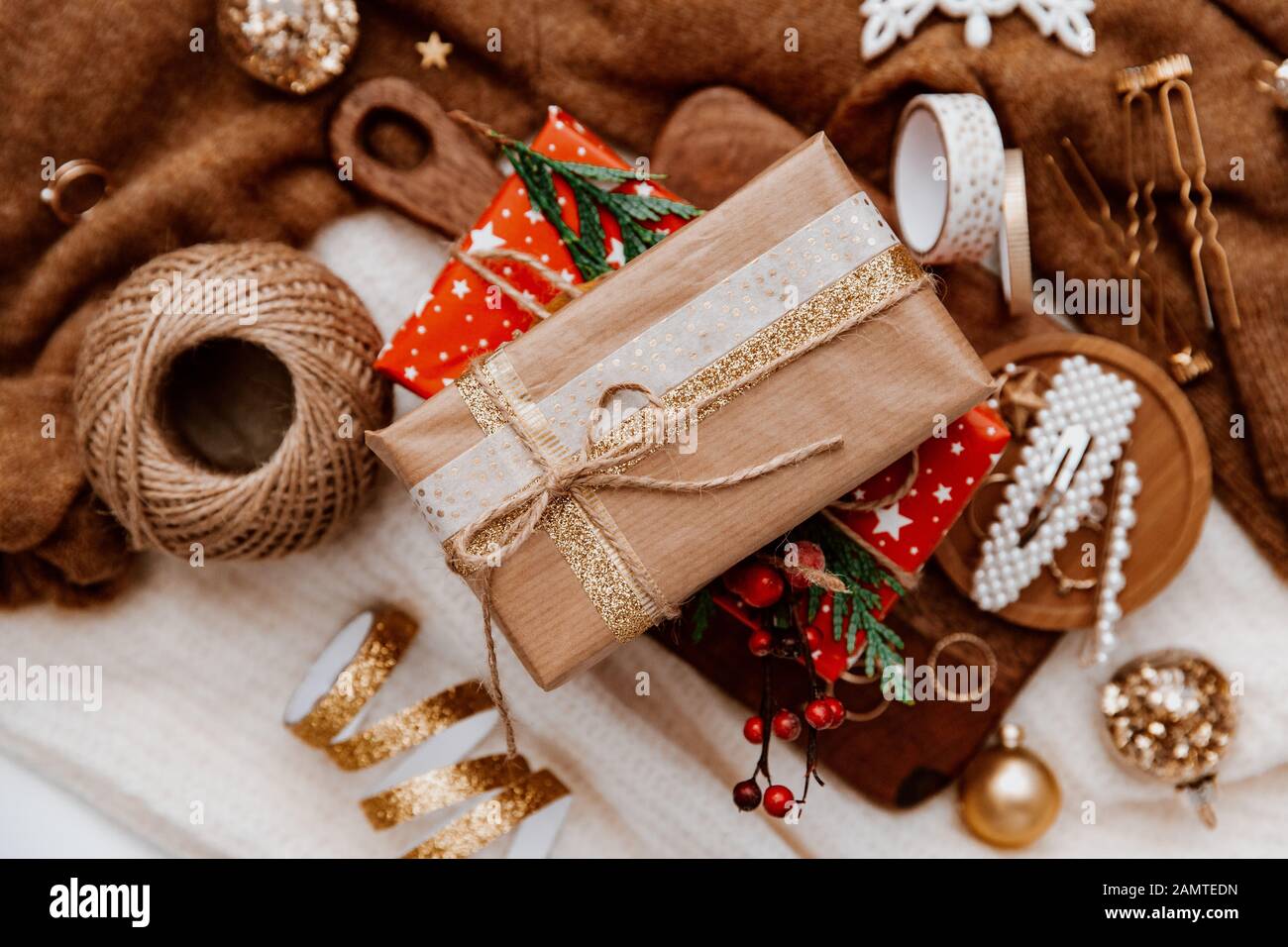 Wrapped Christmas decorations, string, ribbon and Christmas decor Stock Photo