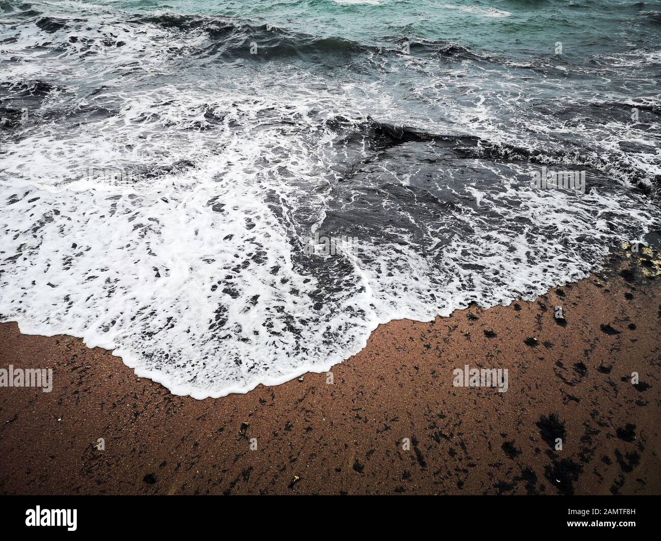 Close-up of ocean waves on beach, Bugibba, Malta Stock Photo