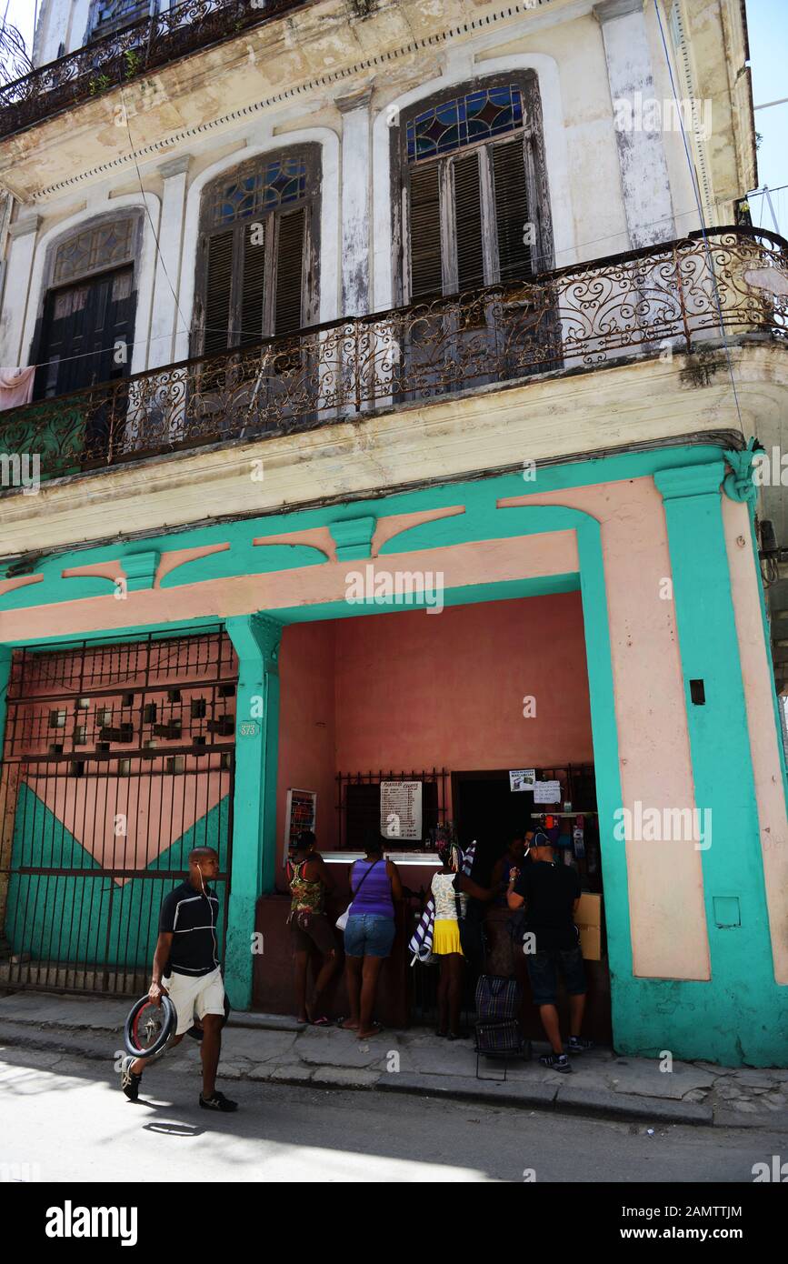 Cubans lining up at a local grocery shop in old Havana. Stock Photo