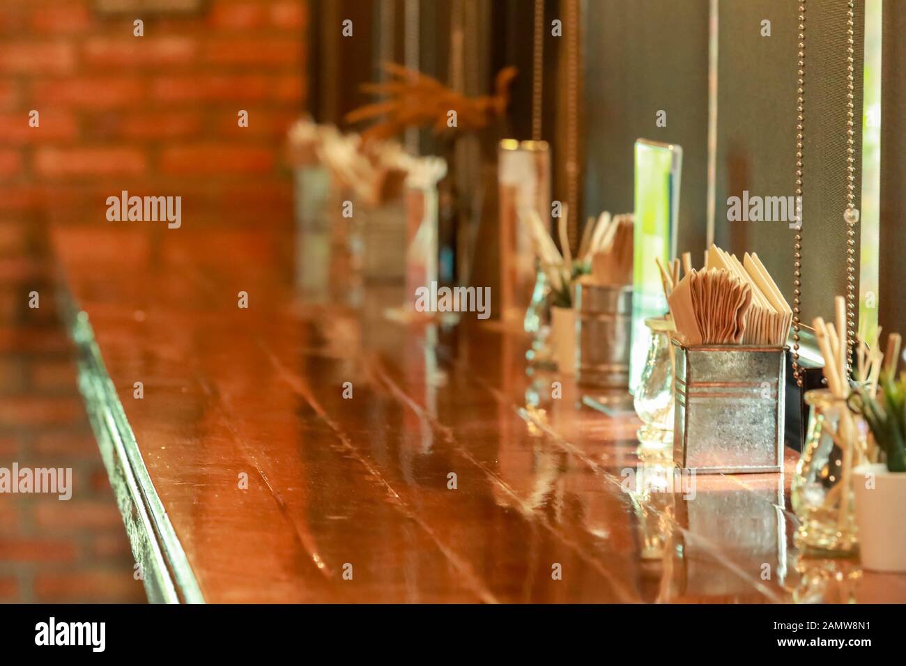 Paper napkin in a galvanized box on a wooden table Stock Photo