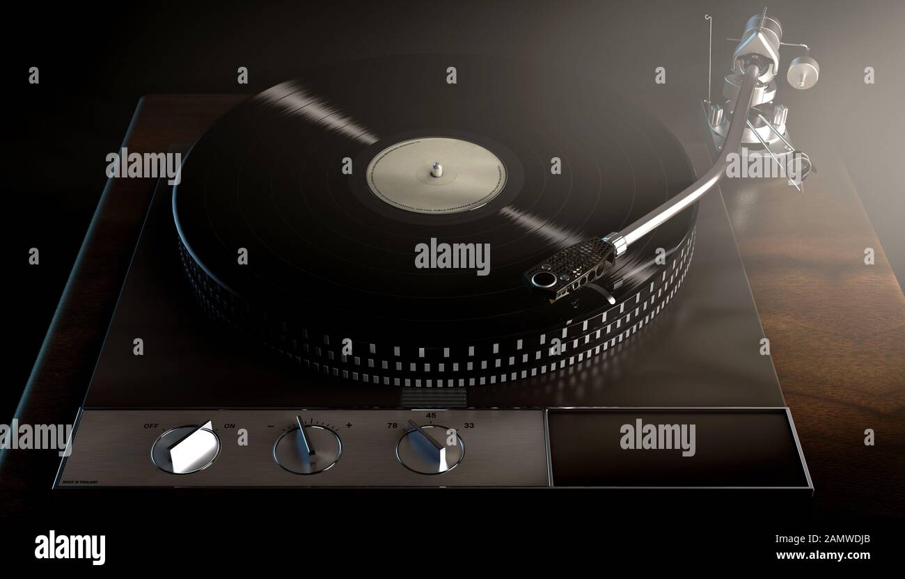 A vintage unbranded turntable playing a vinyl record on a moody backlit ...