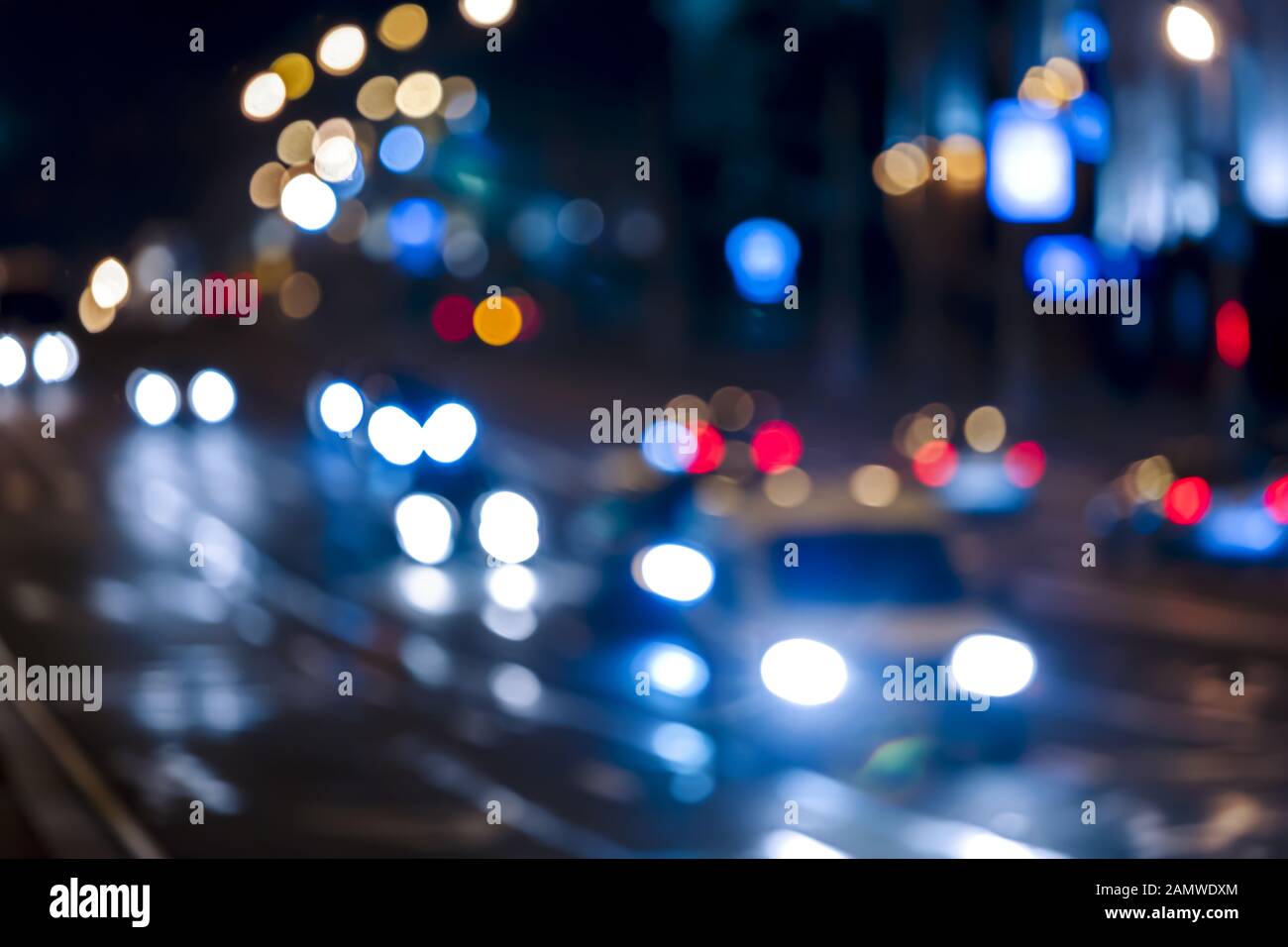 background image of blurred car lights and colorful illumination at night street Stock Photo