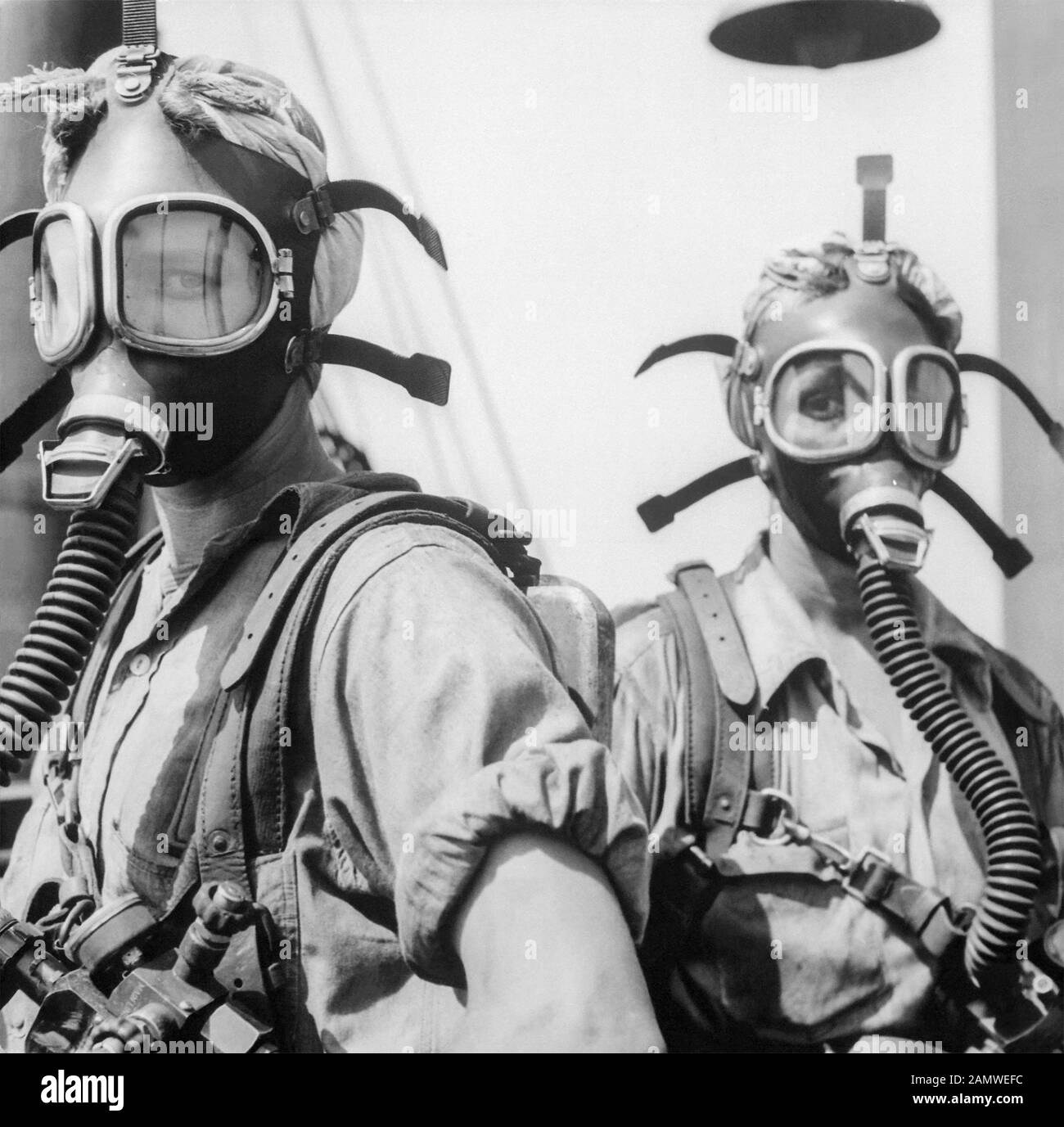 'Top Women' at U.S. Steel's Gary Works in Gary, Indiana, c1945. Wearing oxygen masks as a safety precaution, these women clean up at regular intervals around the tops of twelve blast furnaces. Stock Photo